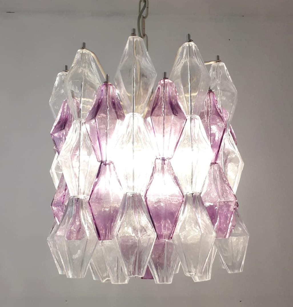 Italian chandelier with clear and amethyst polyhedron/polyhedral shaped Murano glasses, mounted on white metal frames / Made in Italy by Venini, circa 1960s
6 lights / E12 or E14 type / max 40W each
Measures: Diameter 16 inches, height 16 inches