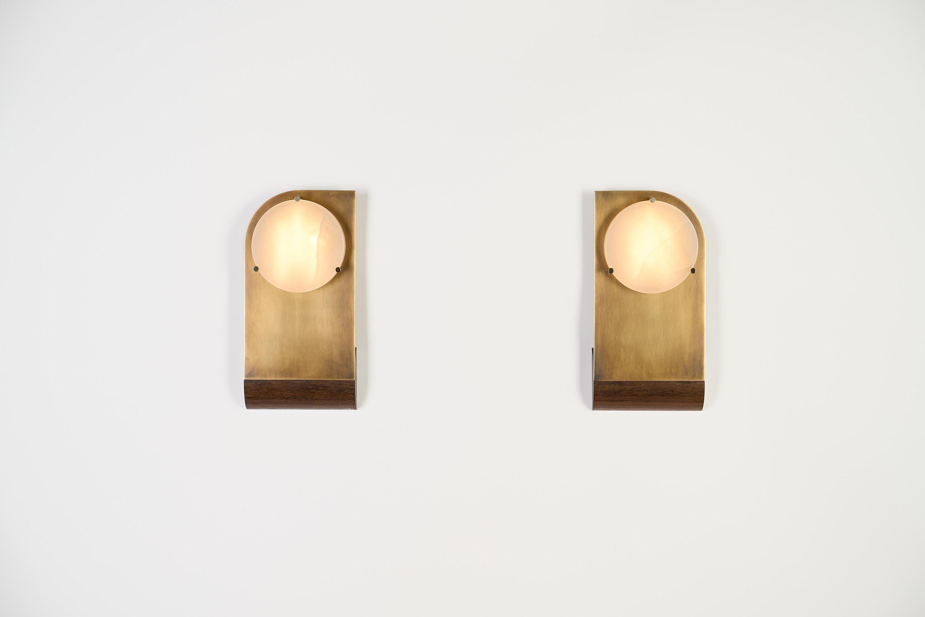 Polifemo Twins is a couple of sculptural sconces designed to illuminate and create gentle light spots beside a mirror, a corridor, or in any setting that requires a balanced lighting composition. 

The piece's name references the Cyclops due to the
