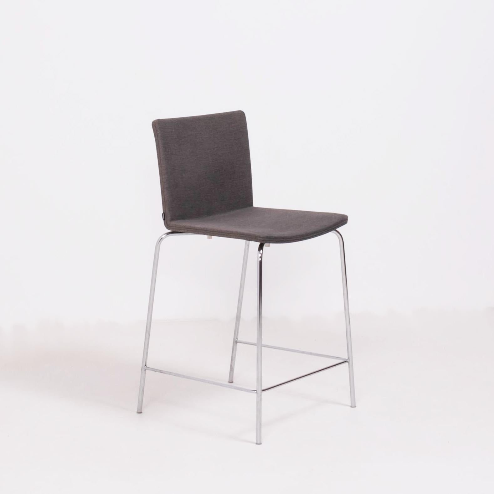 Originally designed by Mario Mazzer for Poliform in 2003, the Nex stool is the epitome of sleek and modern design.

Featuring a chromed metal frame with a foot rail, the seat is molded for comfort and upholstered in a classic light grey