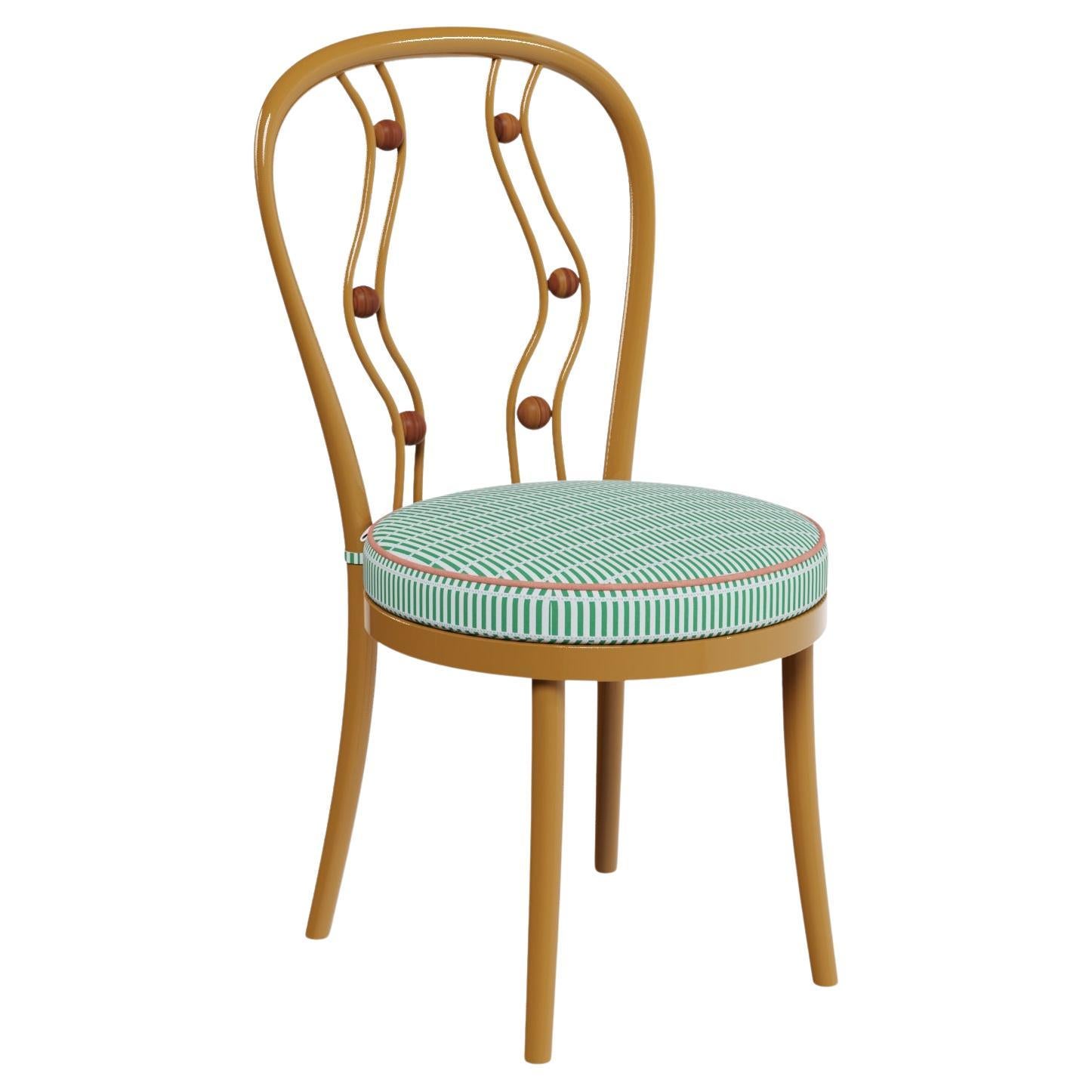 Polignano Outdoor Dining Chair with Sculptural Back and Patterned Cushion