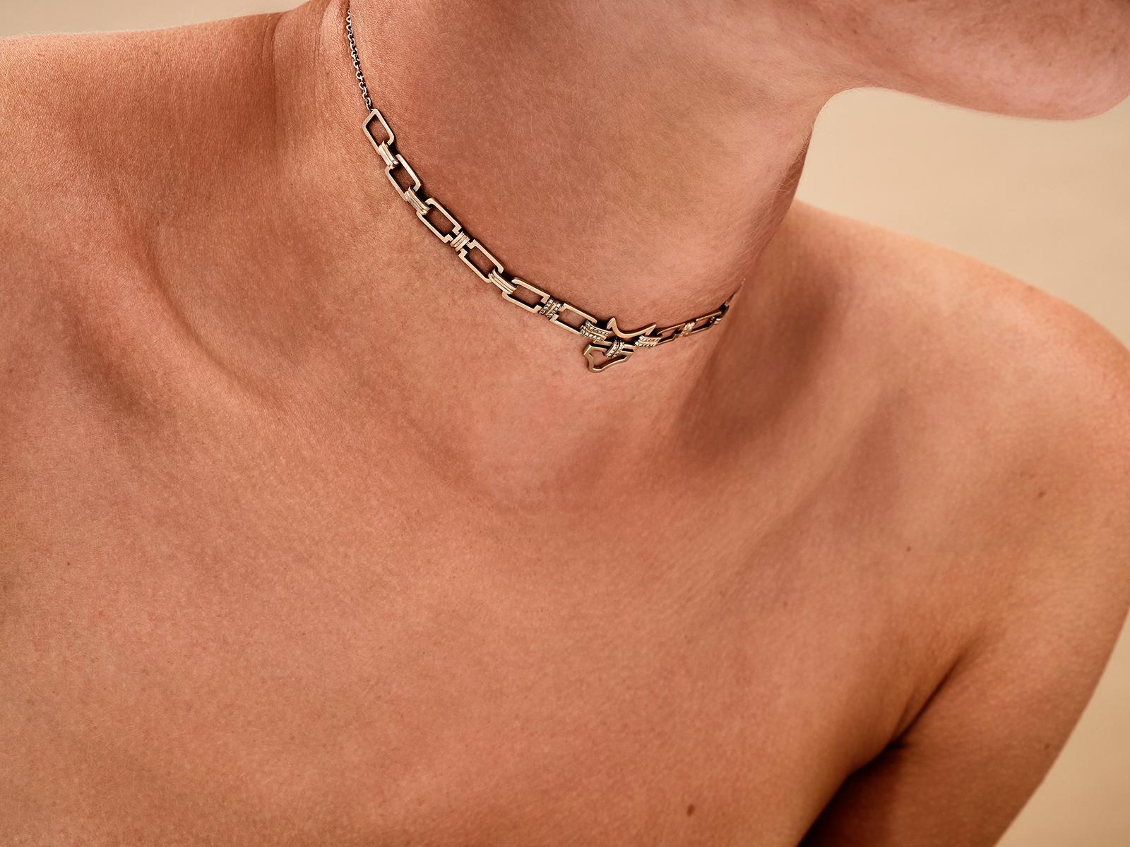 This necklace from POLINA ELLIS' ENOSIS-MINOTAVROS collection is handcrafted in 18K raw white gold with 0,09ct white brilliant cut diamonds.
It can be worn as a choker or looser around the neck.
Adjustable Length: 38 - 40cm