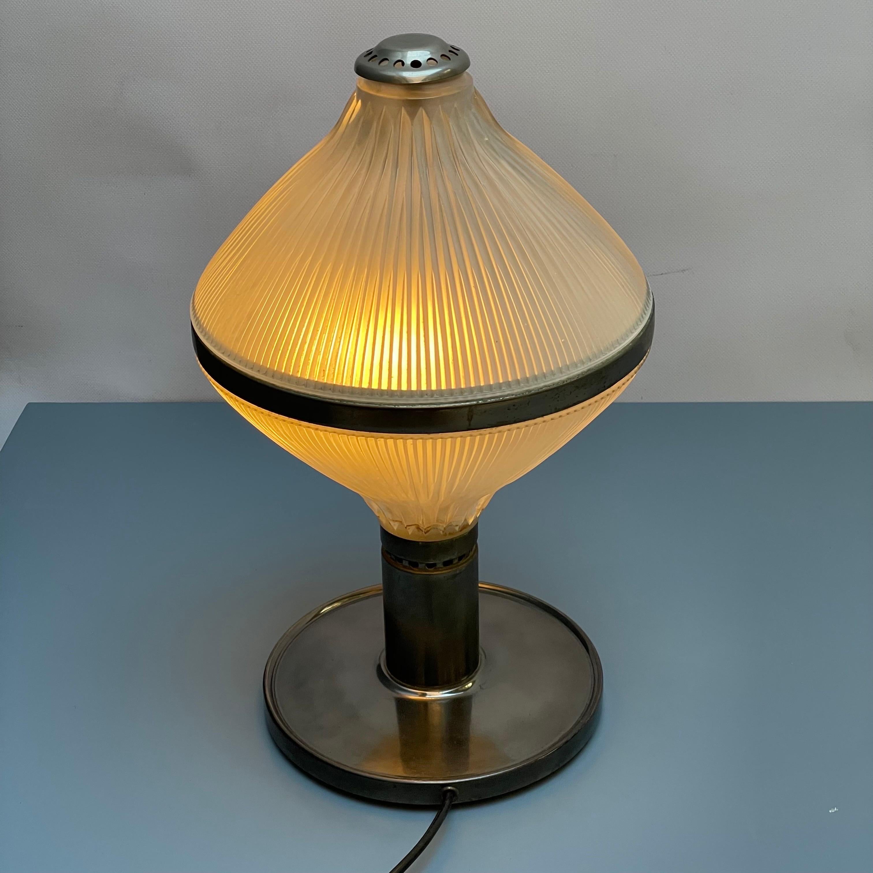 Polinnia table lamp, design Studio BBPR, Production Artemide, Milan 1950s. Studio BBPR was founded in Milan in 1932, bringing together architects and designers of different origins and cultures: Gian Luigi Banfi, Lodovico Barbiano di Belgiojoso,