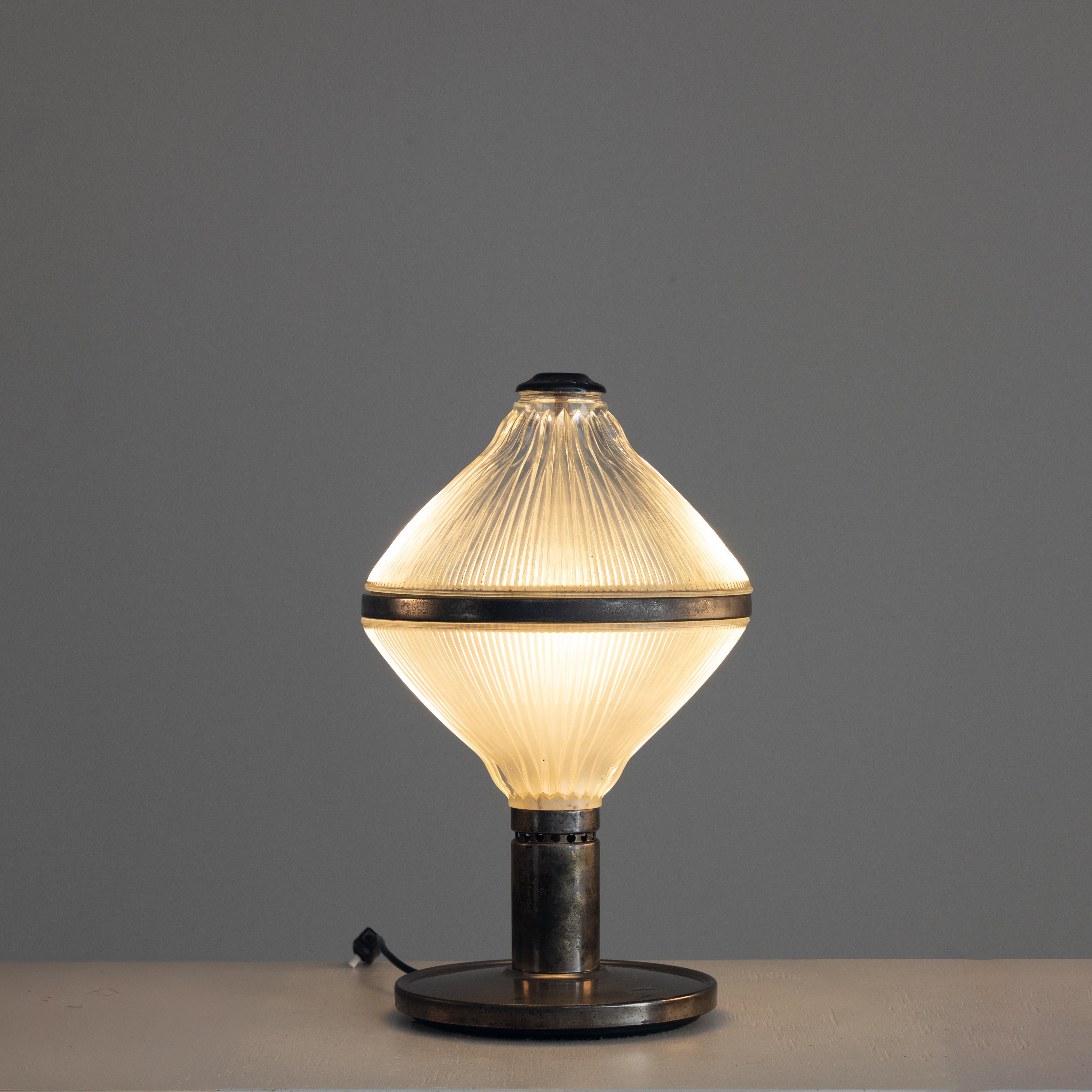 Polinnia table lamp, design Studio BBPR, Production Artemide, Milan 1950s. Studio BBPR was founded in Milan in 1932, bringing together architects and designers of different origins and cultures: Gian Luigi Banfi, Lodovico Barbiano di Belgiojoso,