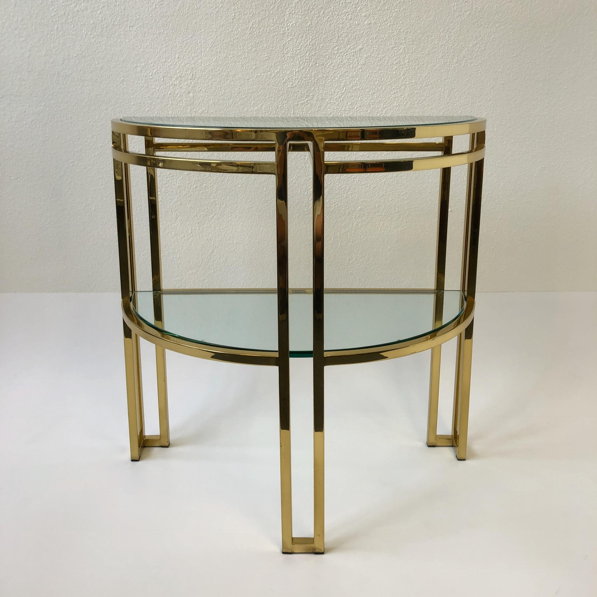 A glamorous polish brass and glass demilune two-tier console table by Milo Baughman.
Dimensions: 30” high 32” wide 16” deep.