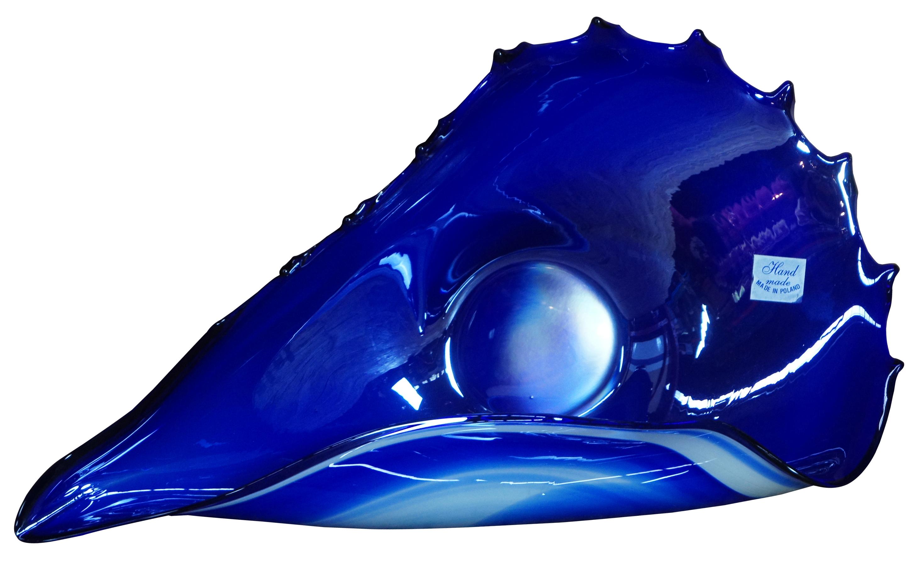 Vintage hand blown free form studio art glass bowl in blue and white, abstractly reminiscent of a seashell, made in Poland.
  
