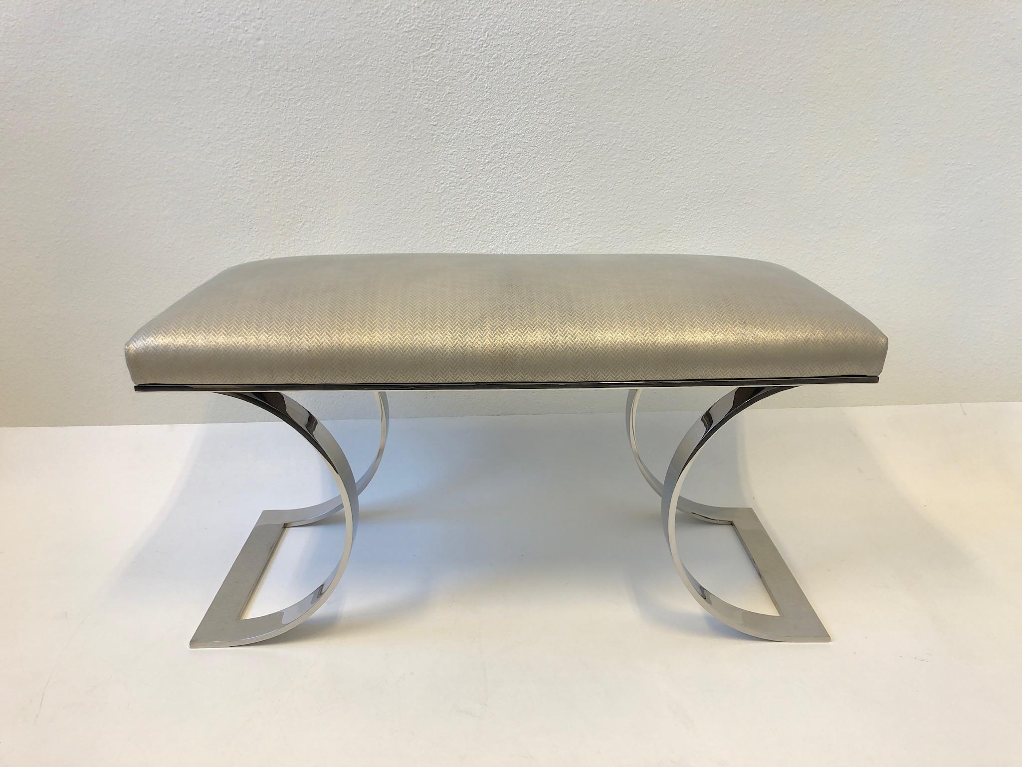 A spectacular 1970s polished stainless steel and suede leather “JMF Bench” by renowned American designer Karl Springer. The bench is constructed of solid stainless steel that’s polish, newly recovered in a soft suede leather with a rose chevron