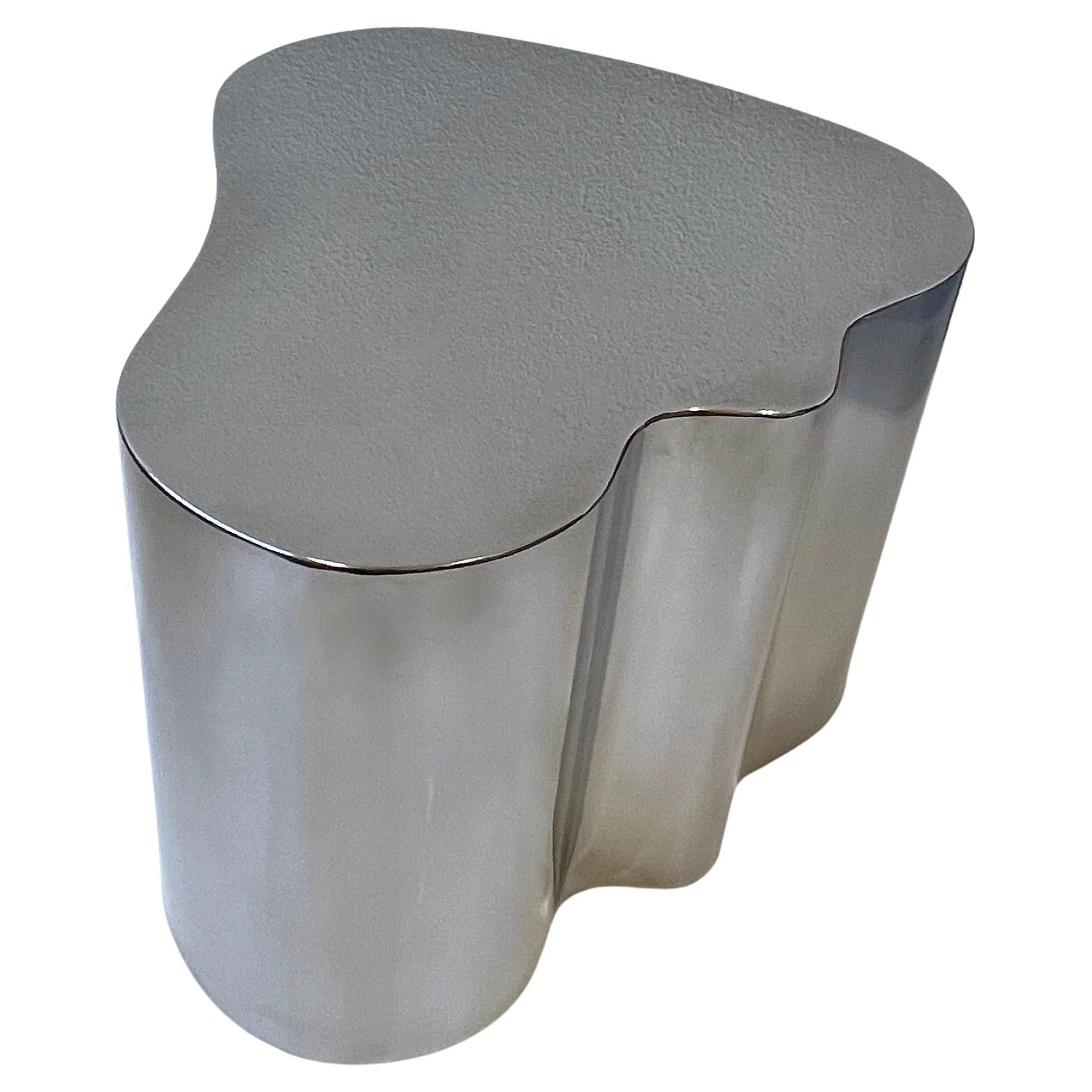 1980s polish stainless steel freeform side table or coffee table by Steve Chase. This was part of a set of three and they were and homage to Karl Springer. 
Constructed of solid stainless steel that’s polished. 
Out of a Steve Chase Design estate