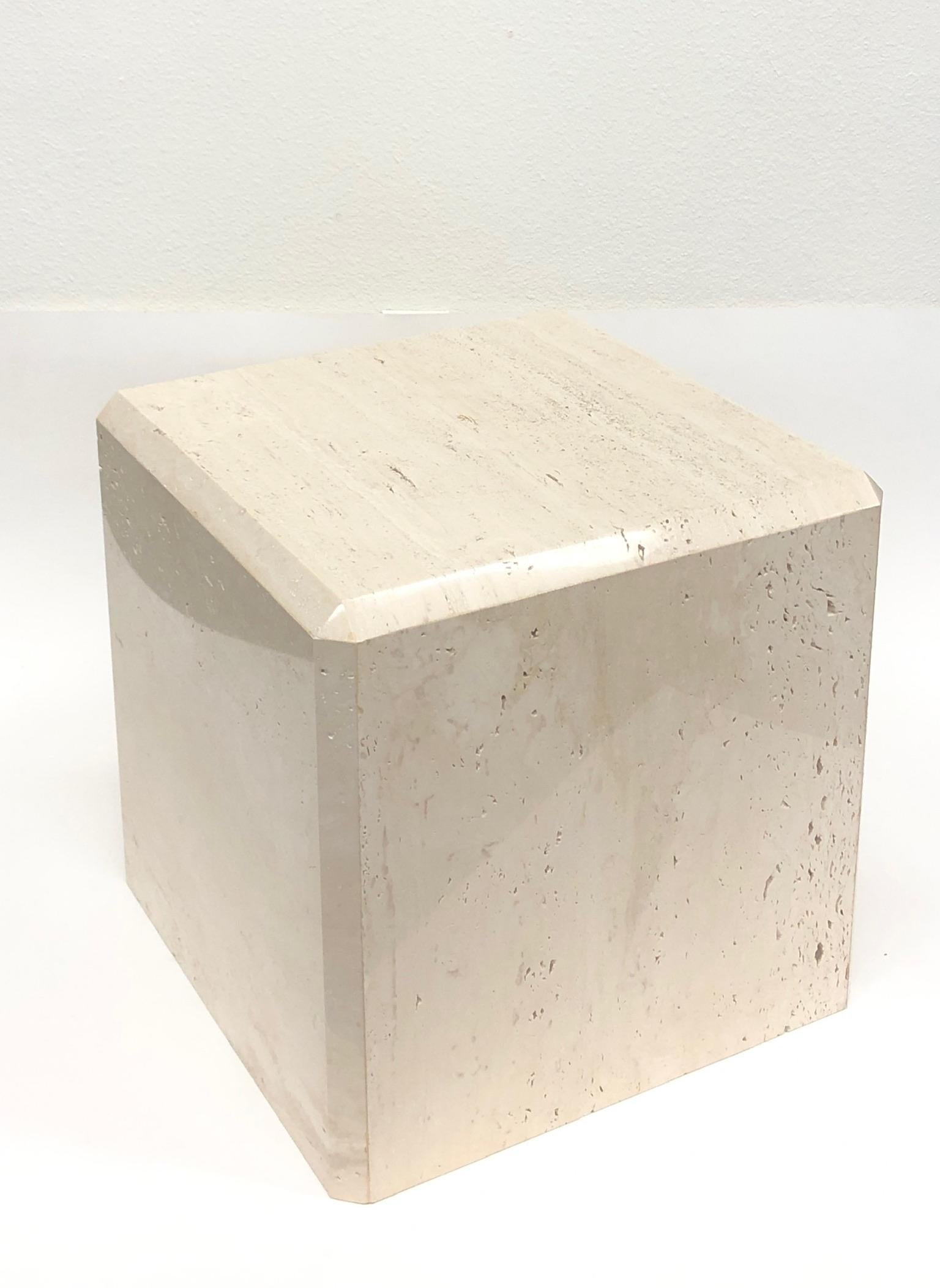 A beautiful Italian travertine cube side table with the edges cut at 45 degrees, design by Kreiss collection in the 1980s. The table still retains part if the Kreiss label.
Dimension: 18” wide, 18” deep, 18” high.