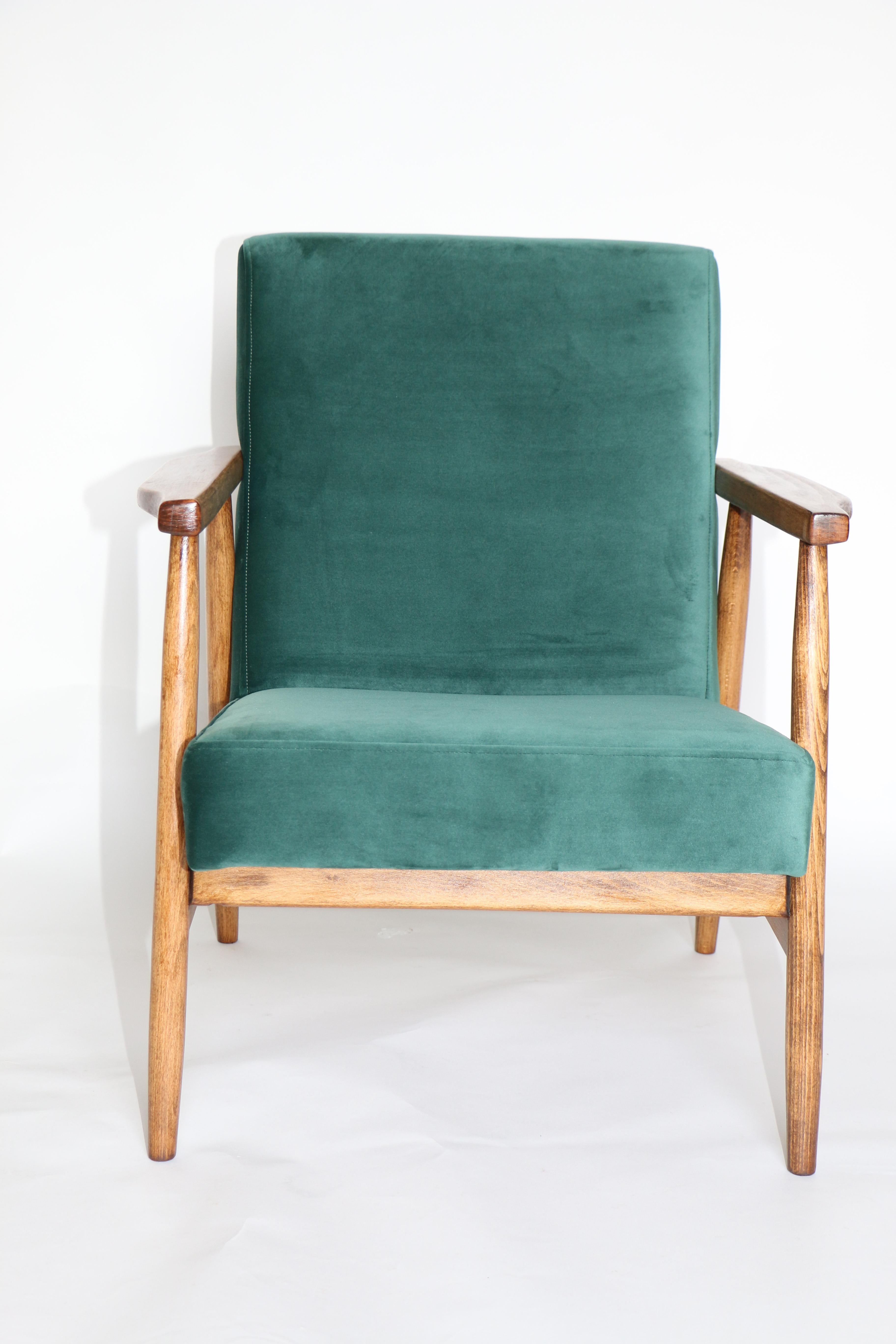 Polish armchairs in bottle green velvet from 1970s, new upholstery covered with velvet fabric in fashionable green color, finished with wooden chair cushion. Wooden elements in natural oak color. Perfect condition. This model is one of the most