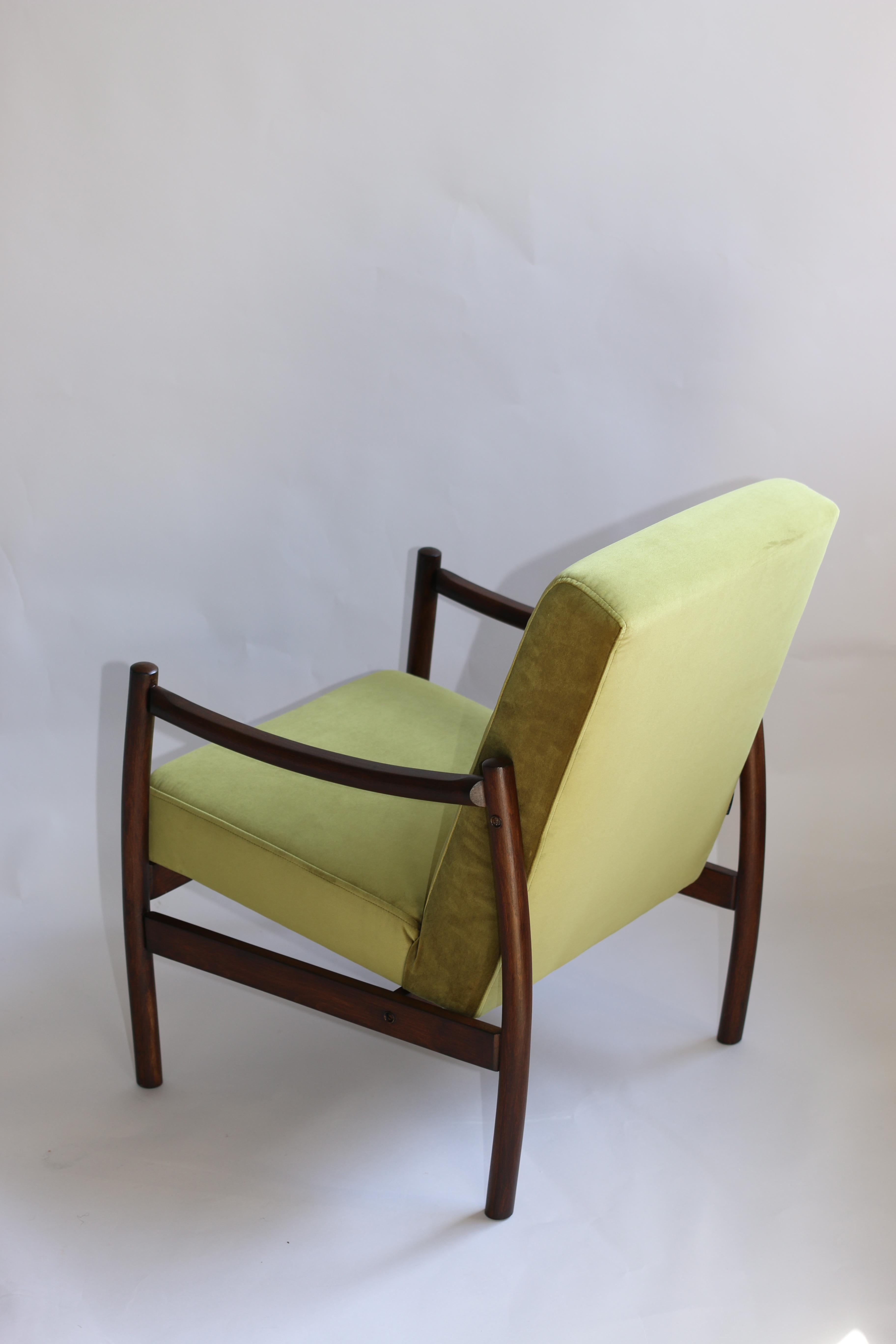 Restored polish armchairs in green velvet from 1970s, new upholstery covered with velvet fabric in fashionable green color, finished with wooden chair cushion. Wooden elements in dark oak color. Perfect condition. 

Dimension H 80 x W 58 x D 59.