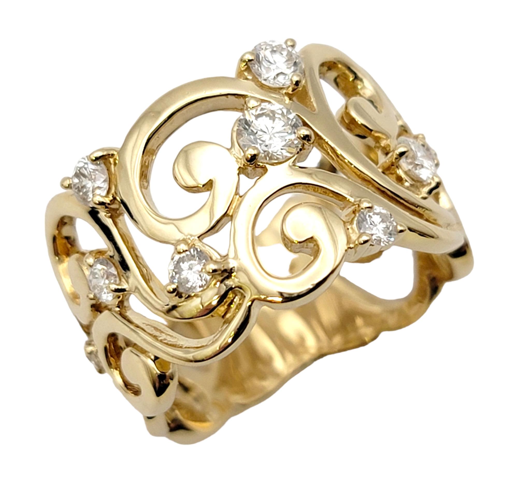 Ring size: 6.75

We simply adore how this swirling, sparkling band ring looks on the finger. The sparkling diamonds shine against the warm yellow gold setting while the open scroll motif gives added interest and design.  

The elegant band ring with