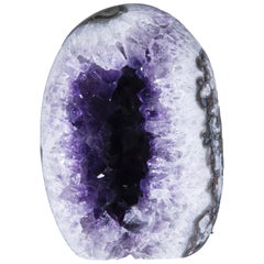 Polished Amethyst Egg Geode Surrounded by White Quartz and Agate Crystals