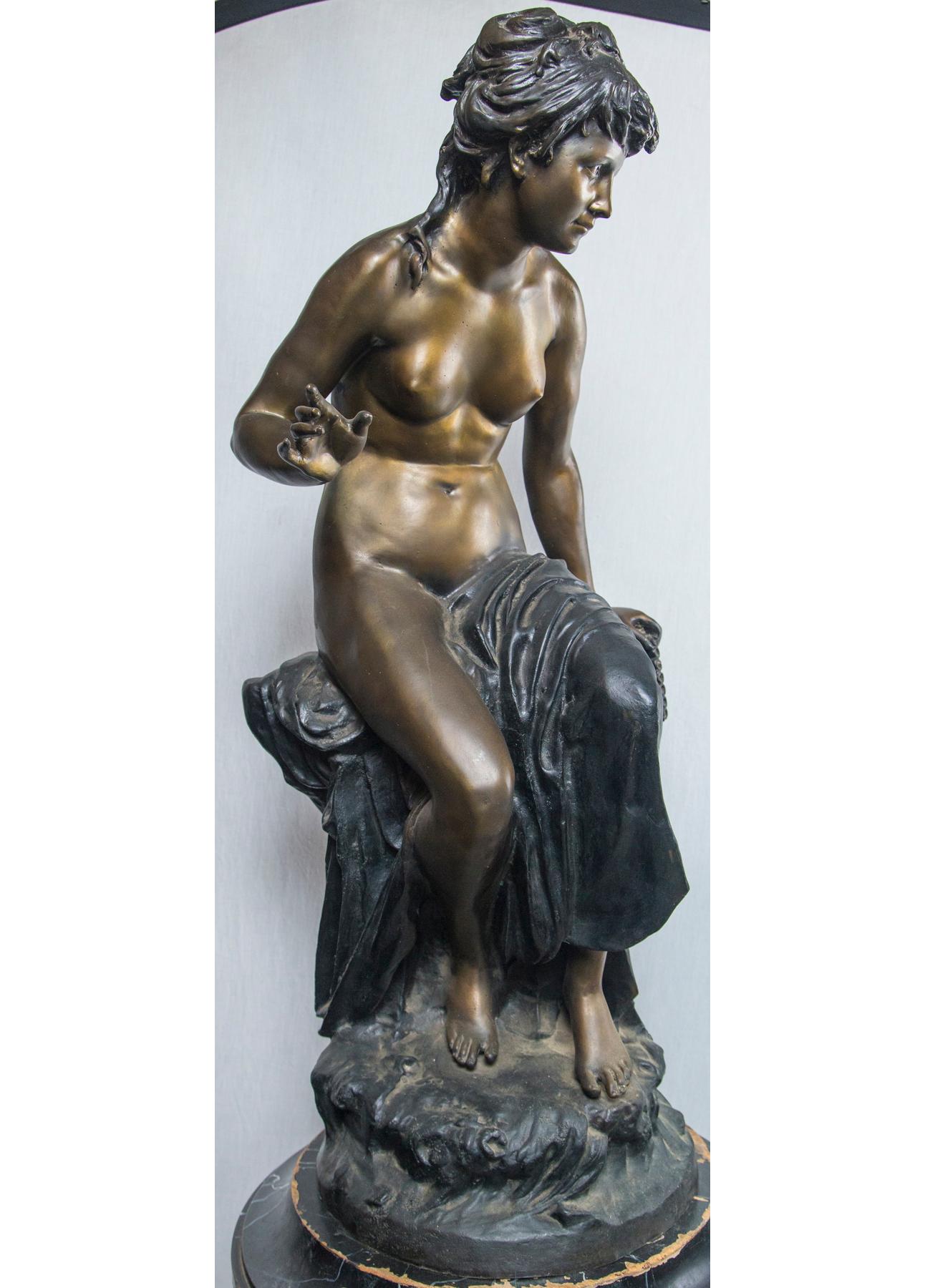 This bronze is a reproduction.
She sits upon a tree stump and holds, in her left hand, a set of pan's pipes.
Illegible signature
the base is 12 inches in diameter
