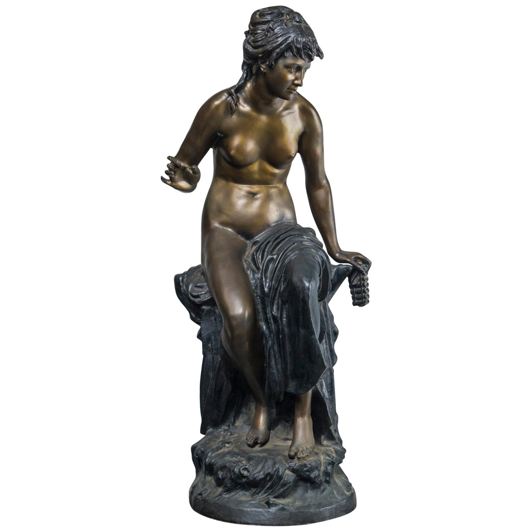 Polished and Patinated Semi Nude Bronze Statue of a Female For Sale