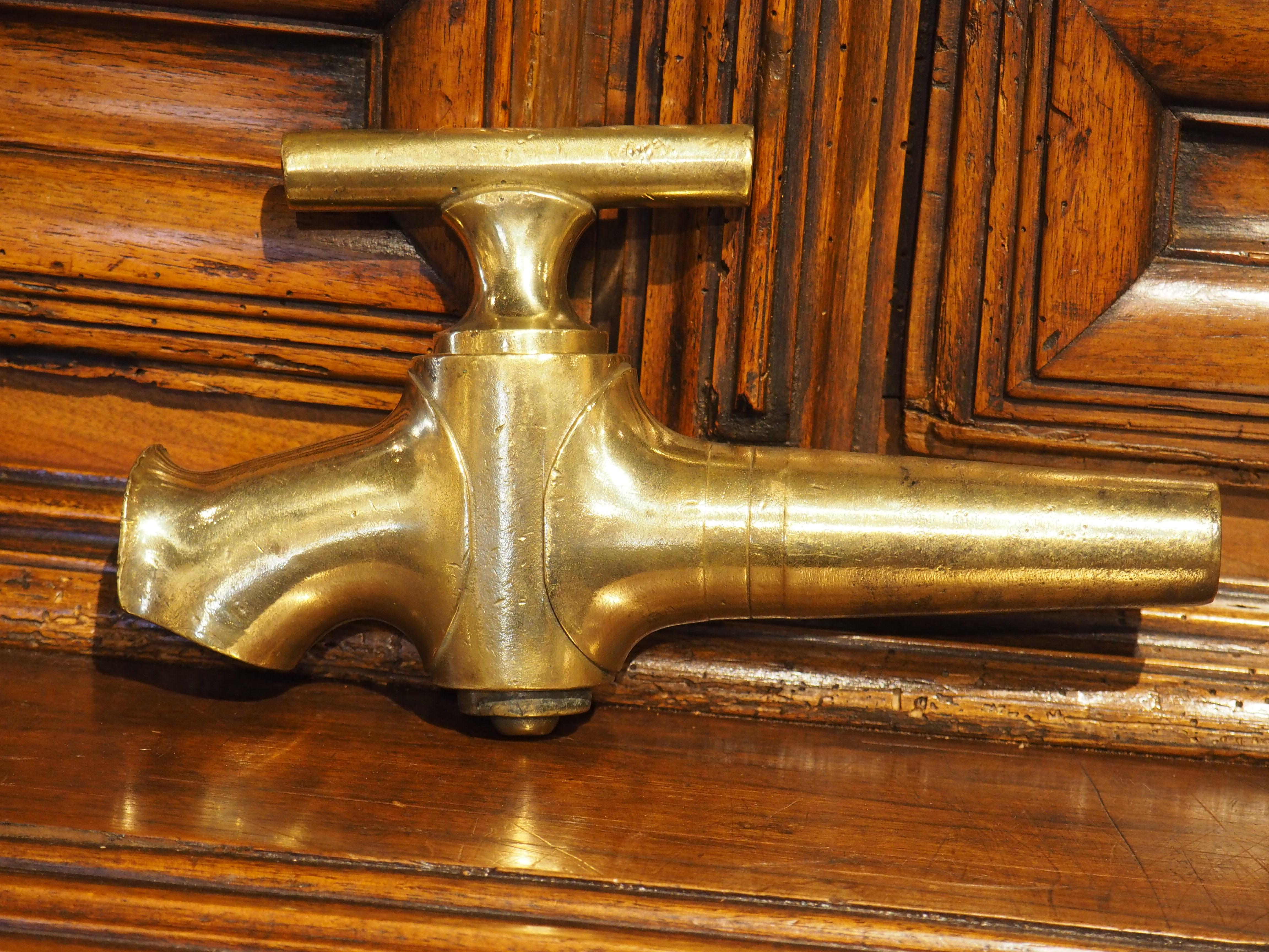 This antique bronze wine barrel spout from France dates to the 1800s. Most likely used in a traditional foudre barrel, the spout played an integral role in the winemaking process, managing the flow of wine with precision and care. The corner joint