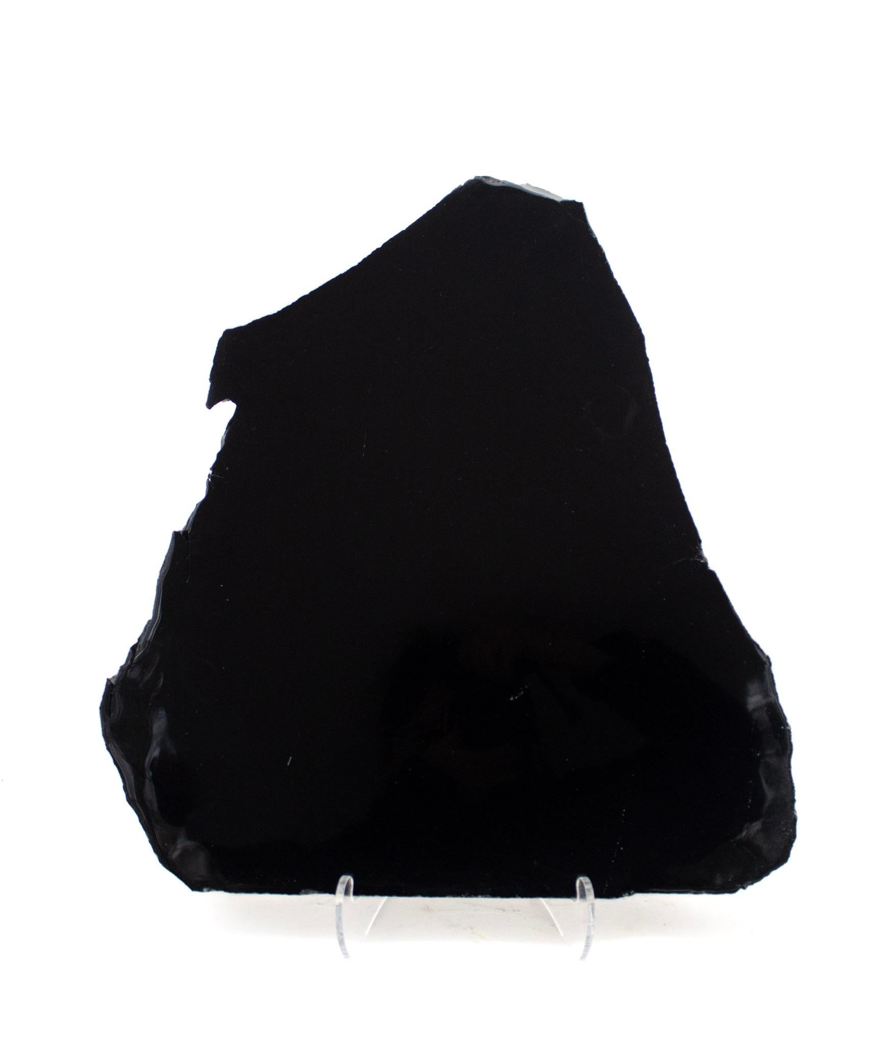 Black polished obsidian slab - similar to what the indigenous Mexican Indians used for their mirrors. 

Obsidian is a naturally occurring volcanic glass formed when lava extruded from a volcano cools rapidly with minimal crystal growth. It is an