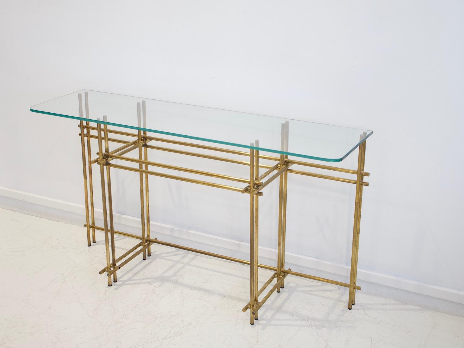 Italian console table and mirror from the late 1960s. Frame made of polished brass, tabletop of cut crystal.
Note that there is a small scratch on the mirror as seen on a photo.
Dimensions: Console height 72 cm, width 130 cm, depth 36 cm, mirror