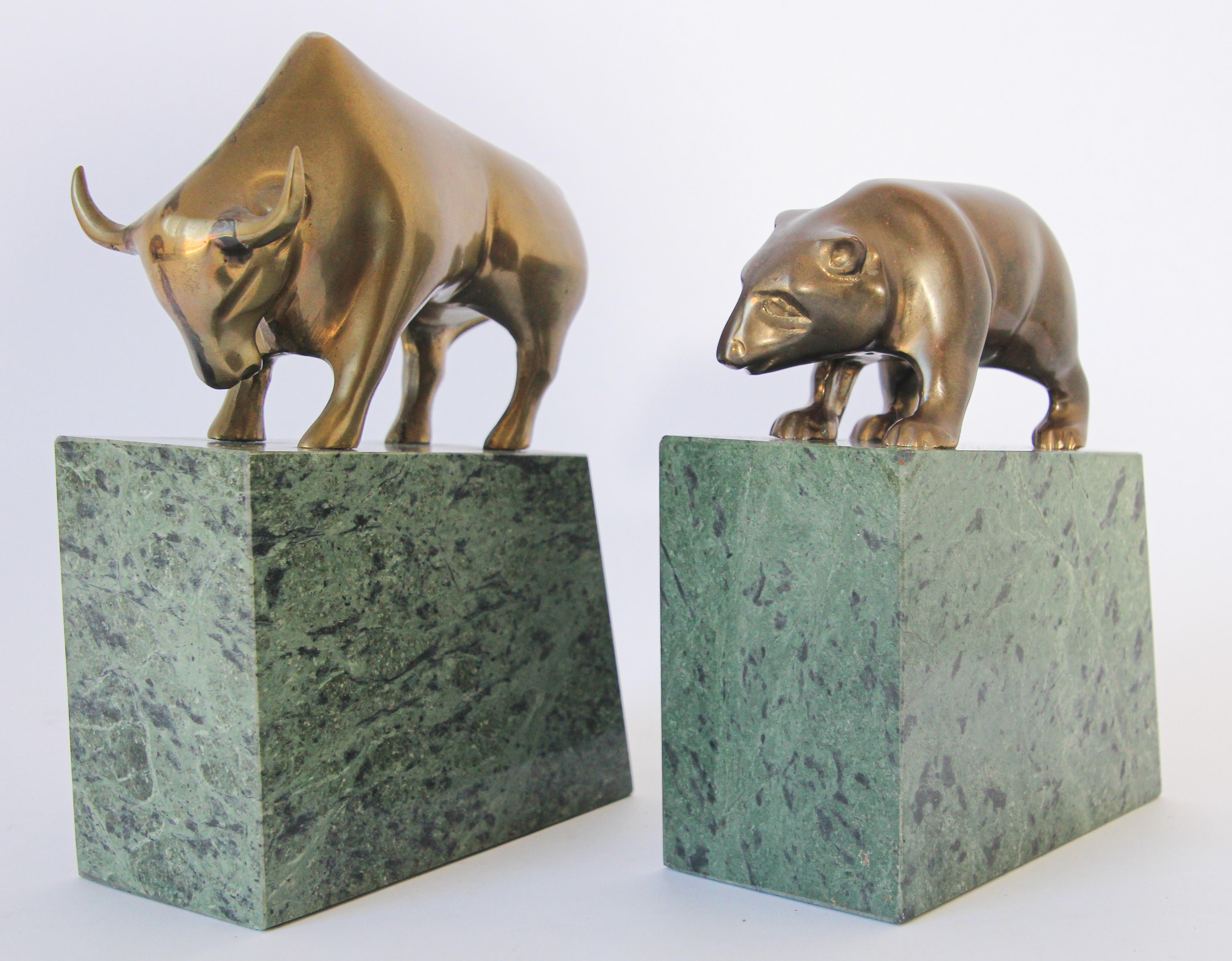 Vintage Art Deco style brass bull and bear bookends, paperweights.
This stunning vintage Wall Street bull and bear broker decorative desk decoration, bookends are just gorgeous. .
These polished Heavy cast brass bull and bear bookends animals are