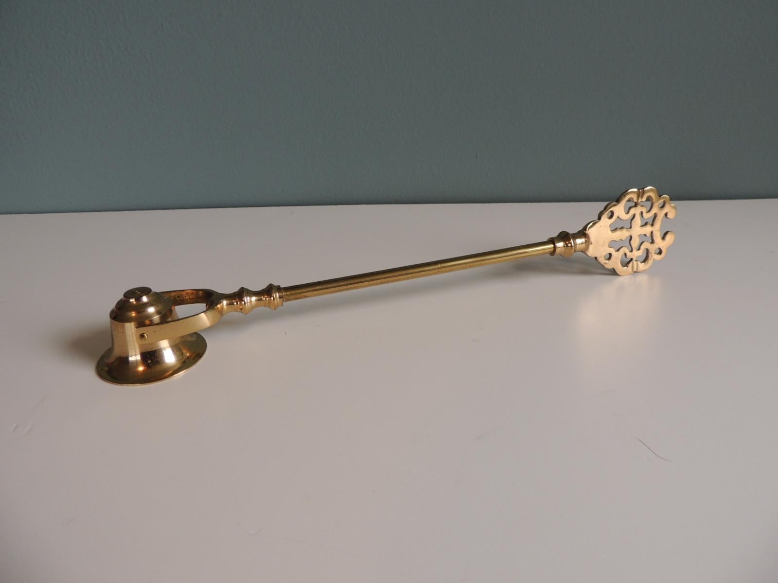 Polished Brass Celtic style candle snuffer with pierced handle.
Size: 13.5