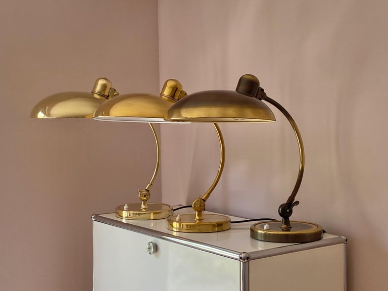 Original brass Christian dell desk lamp model 6631 Luxus / president for Kaiser Idell, Germany. Solid brass shade, arm and rim. Arm and shade adjustable. With E26/27 Edison screw socket. Very nice condition and ready to use with 110 and 250V.
Price