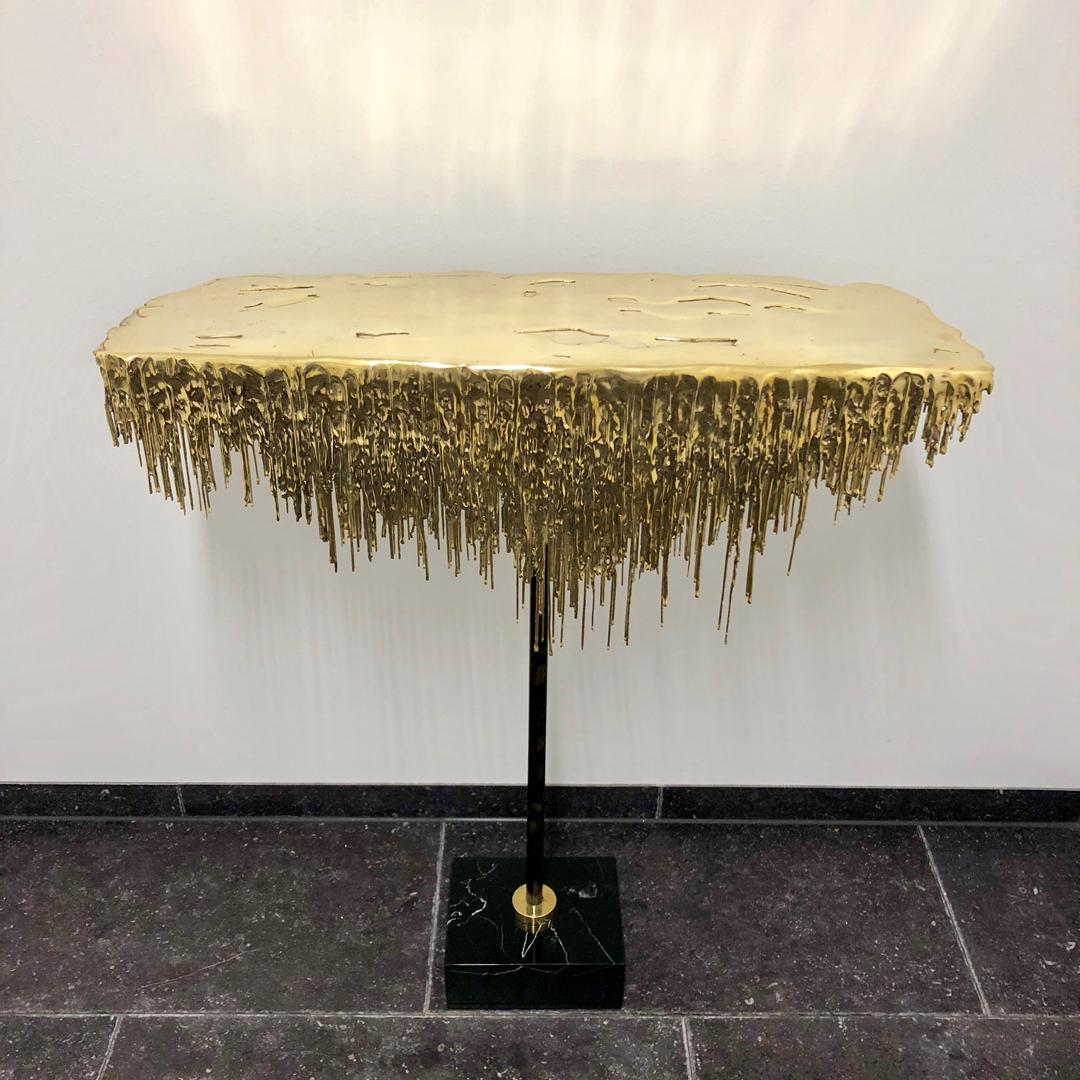 Polished brass console with black and white marble feet, amazing, gorgeous and poetic. Brilliant high quality European handmade. New items never used.