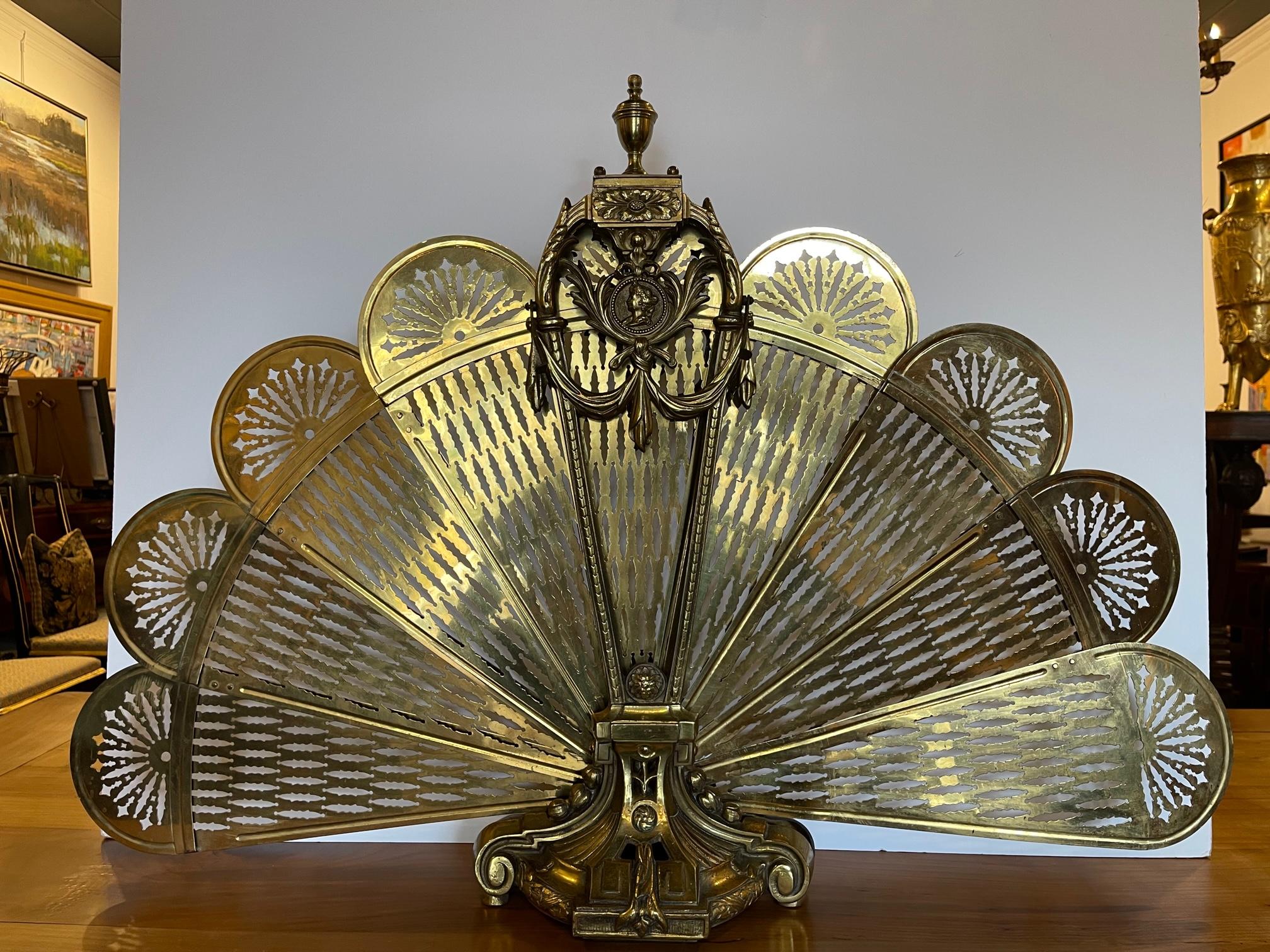 Polished brass fan fire screen, 19th century.