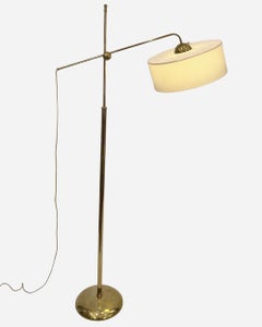 Polished brass floor lamp in the style of Robert Mathieu, France circa 1950