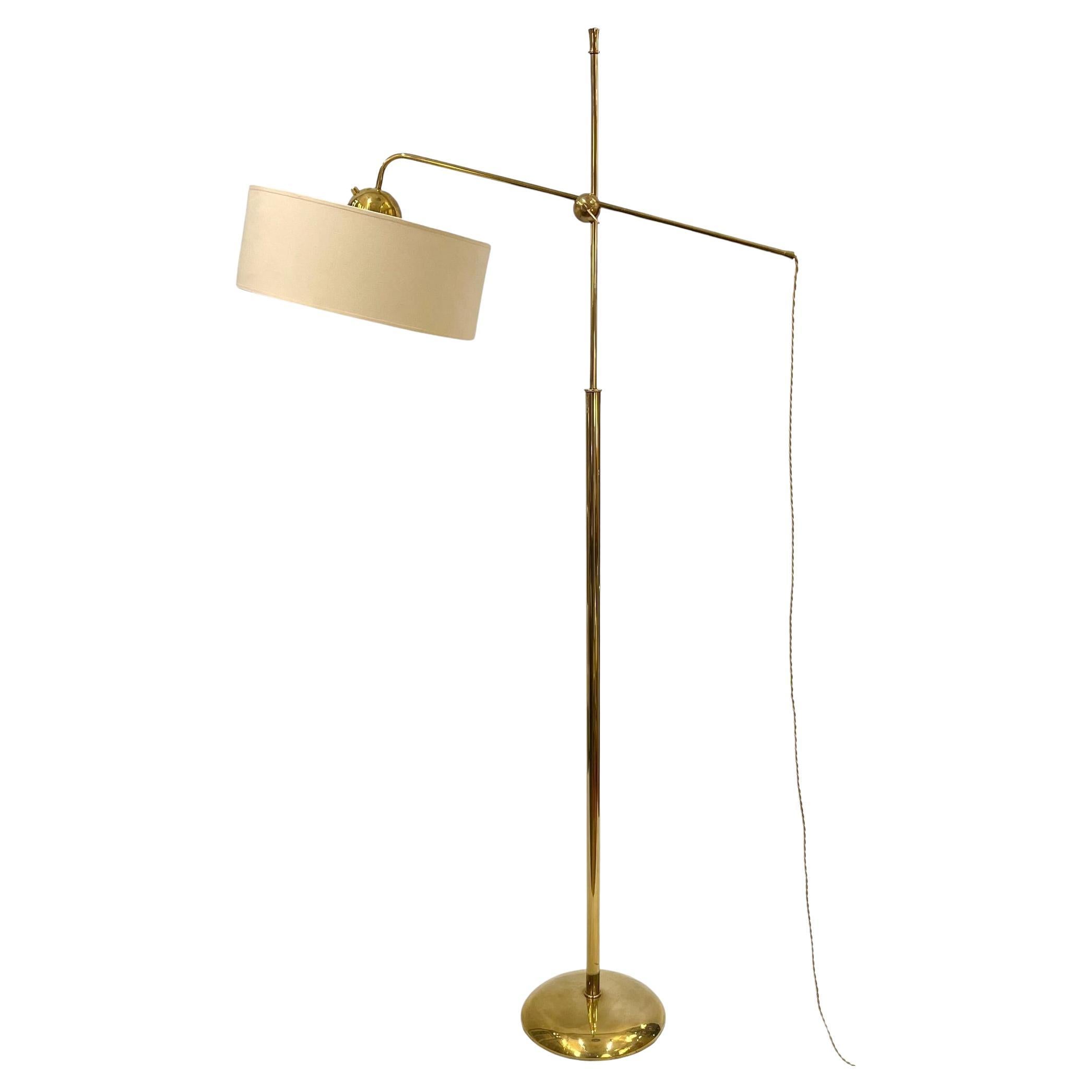 Polished brass floor lamp in the style of Robert Mathieu, France circa 1950
