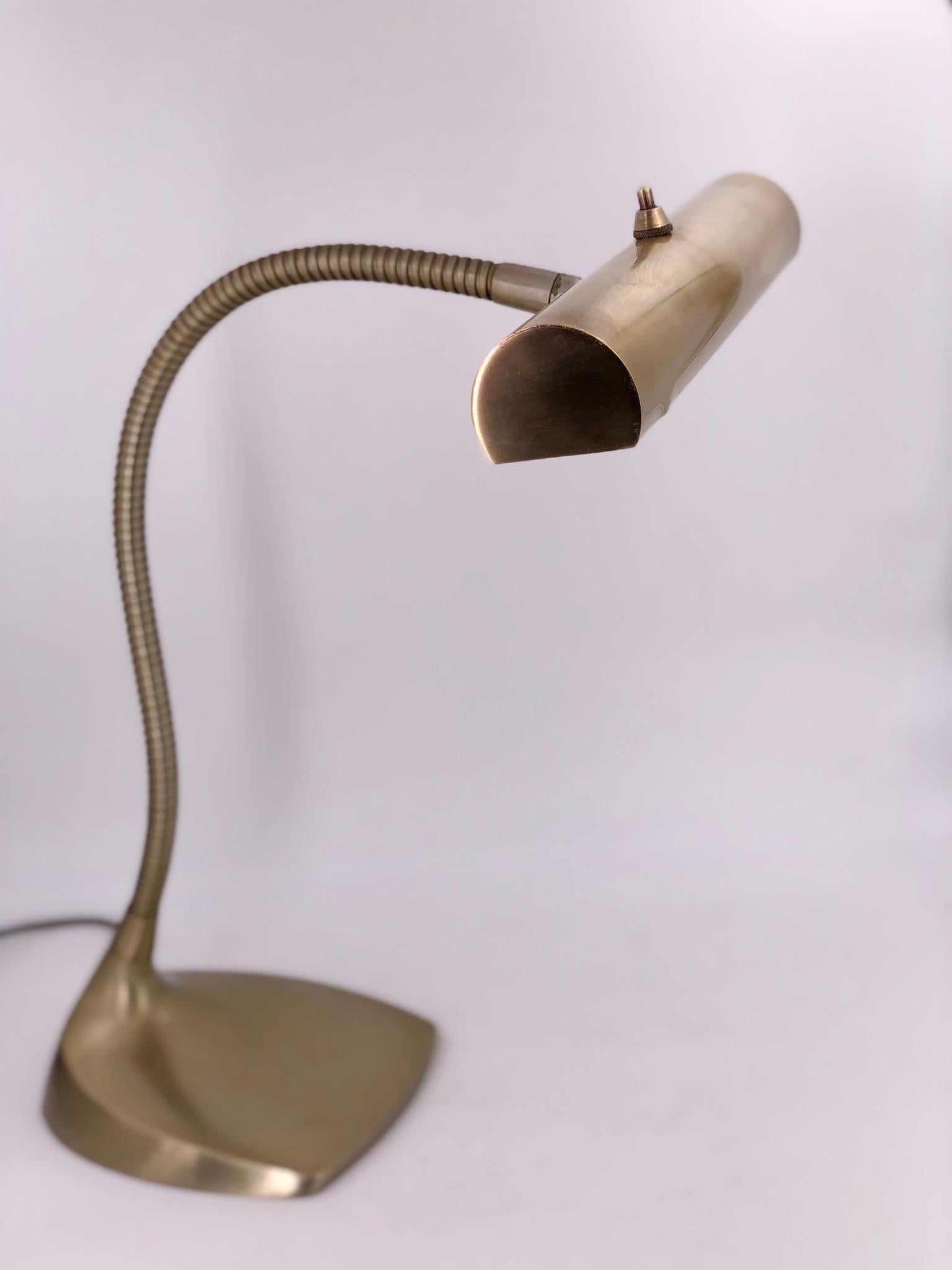 A 1950s rare desk lamp by Laurel Lighting Company. with push off/ on switch in polished brass, nice original working condition.