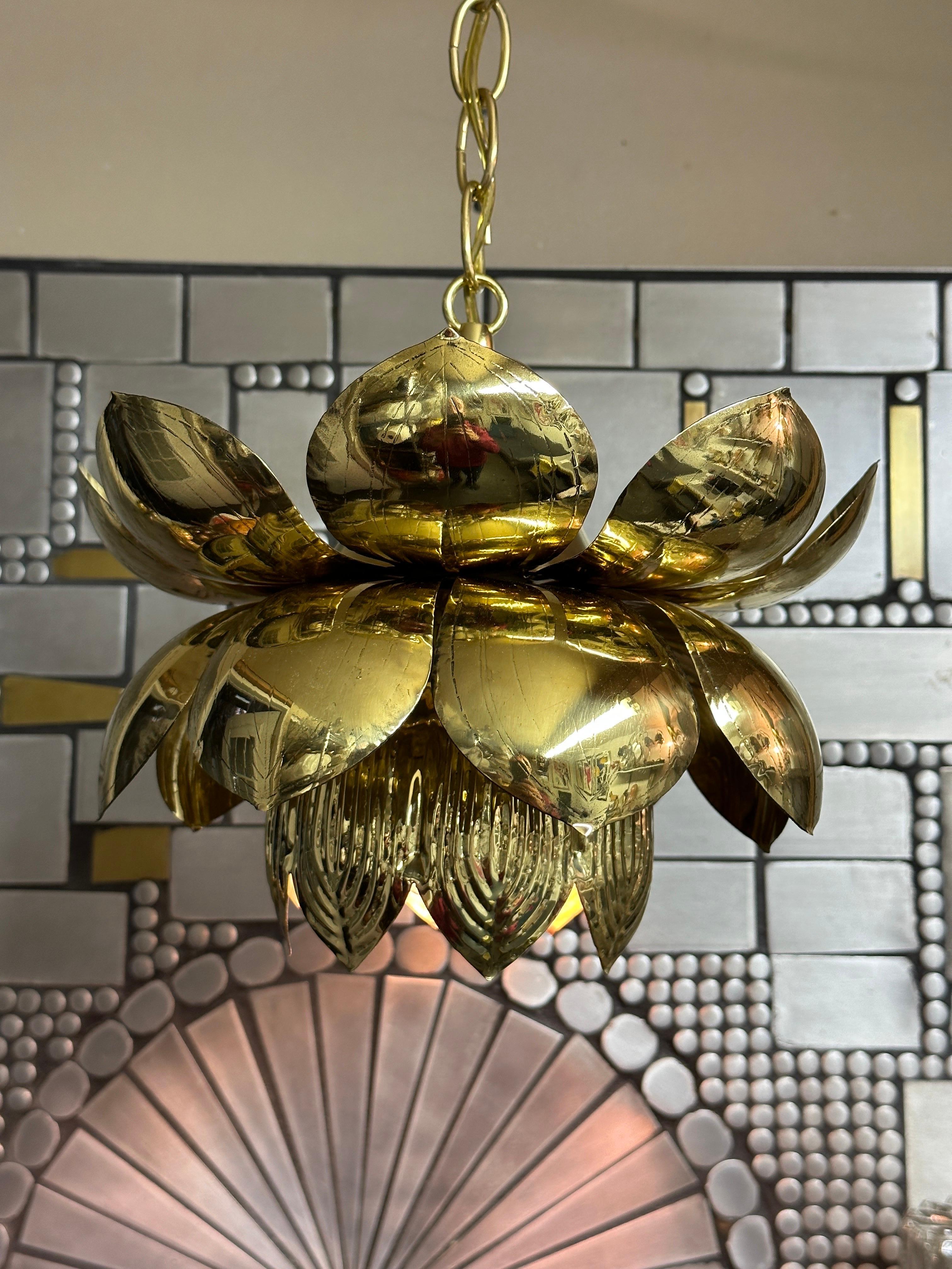 Polished brass lotus hanging pendant light by Feldman. Lotus is 10” diameter by 8” high. Chain is 40” and can be adjusted to your desired height.