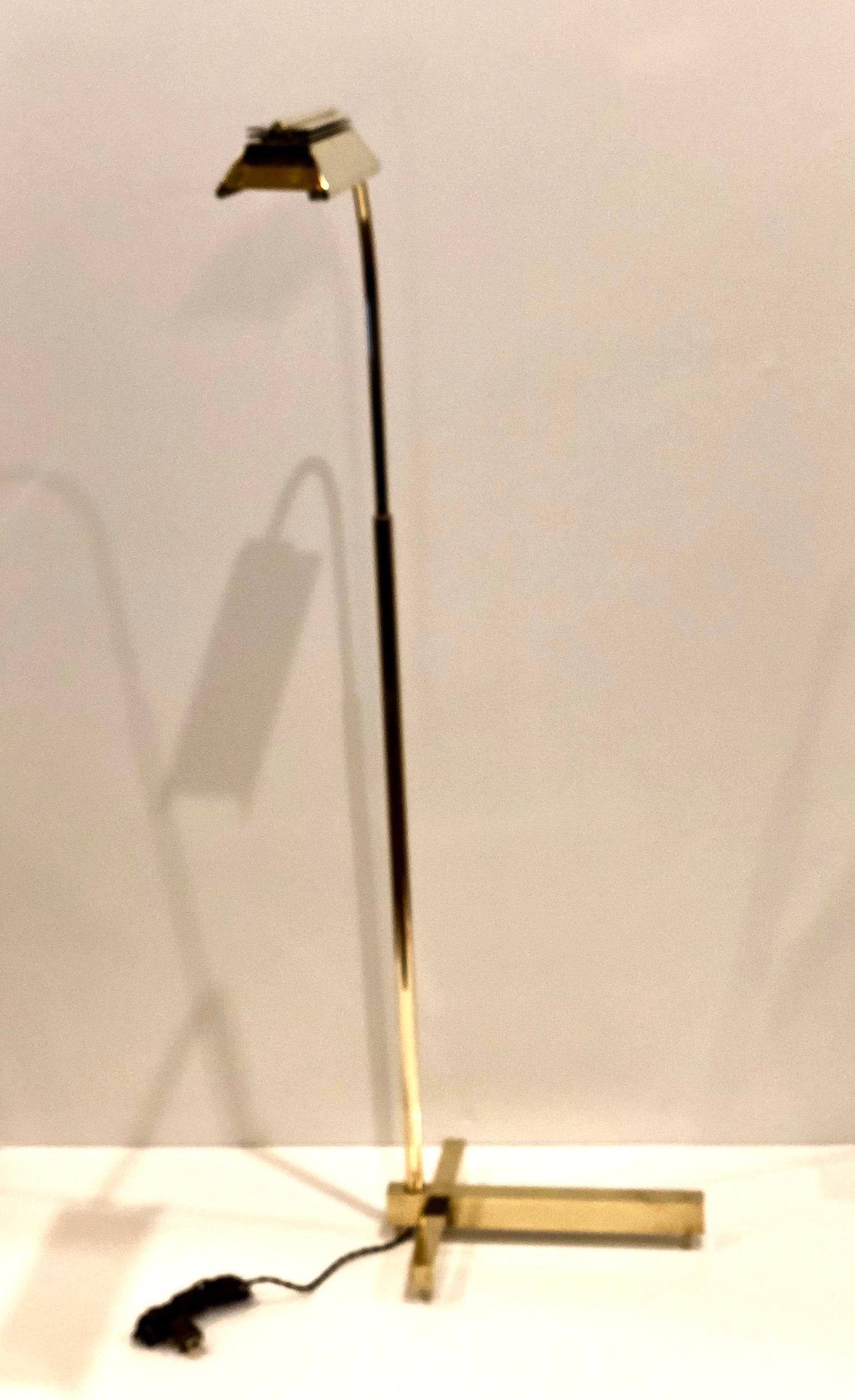 Elegant floor lamp in a polished brass finish by Casella Lighting, circa 1980s. The lamp is multi-directional (goes up and down and rotates from side to side) it has been rewired with twisted cloth cord and with a halogen bulb and dimmer switch. The