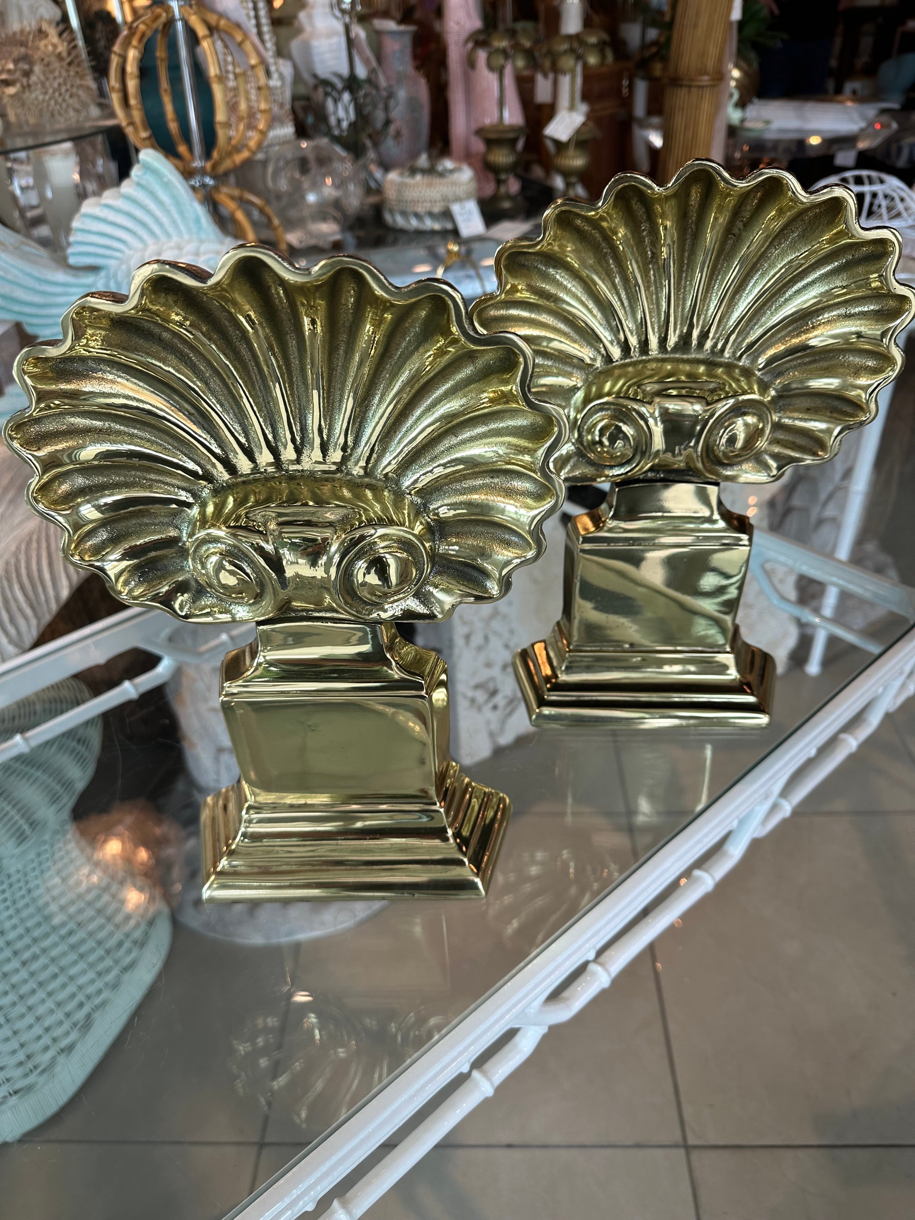 Vintage pair of brass Palm Beach fireplace andirons shell seashell scalloped clam. These have been professionally polished. Dimensions: 12.5 H x 8.5 W x 18 D