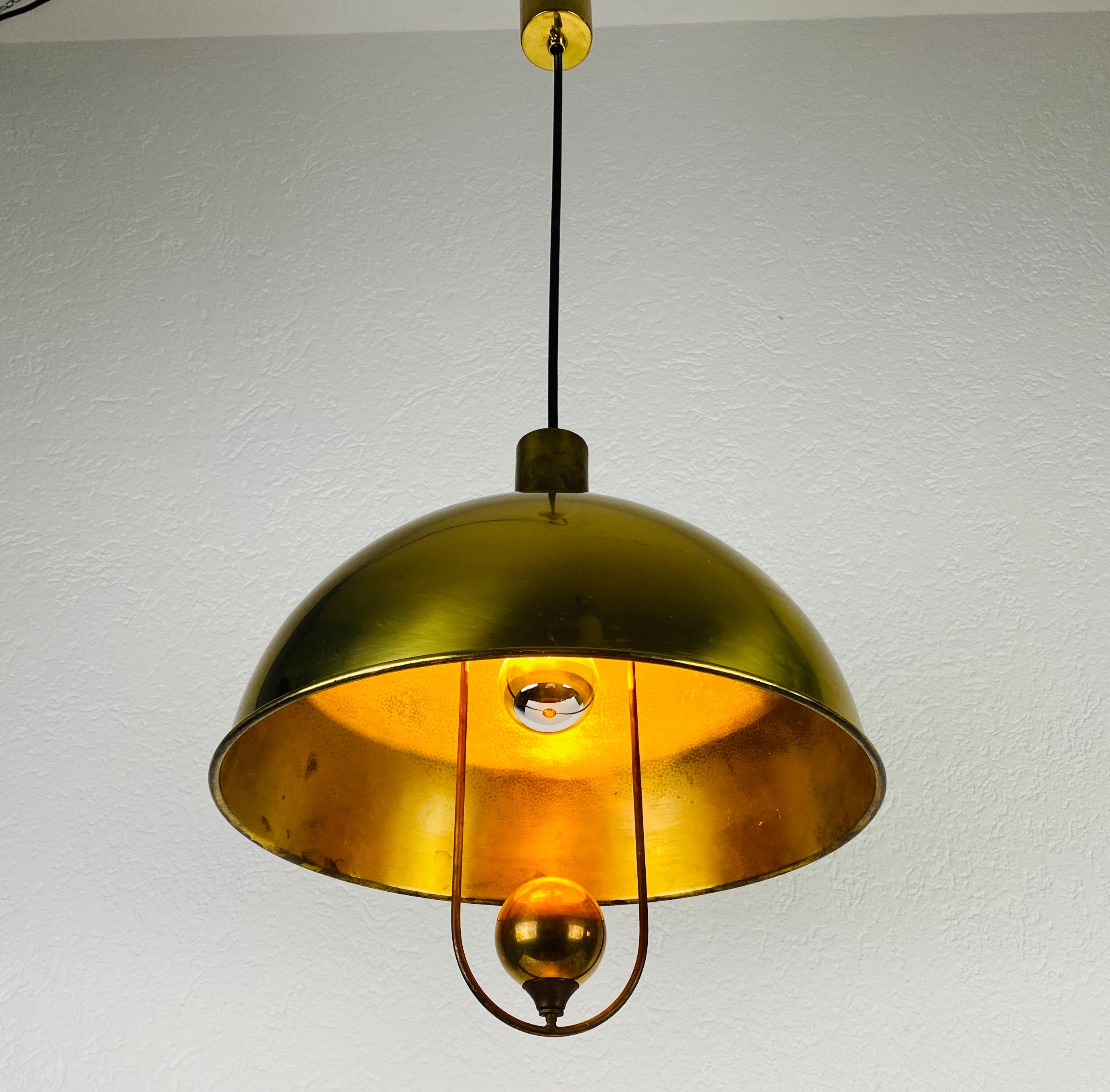 Polished Brass Pendant Lamp by Florian Schulz, 1970s, Germany In Good Condition For Sale In Hagenbach, DE