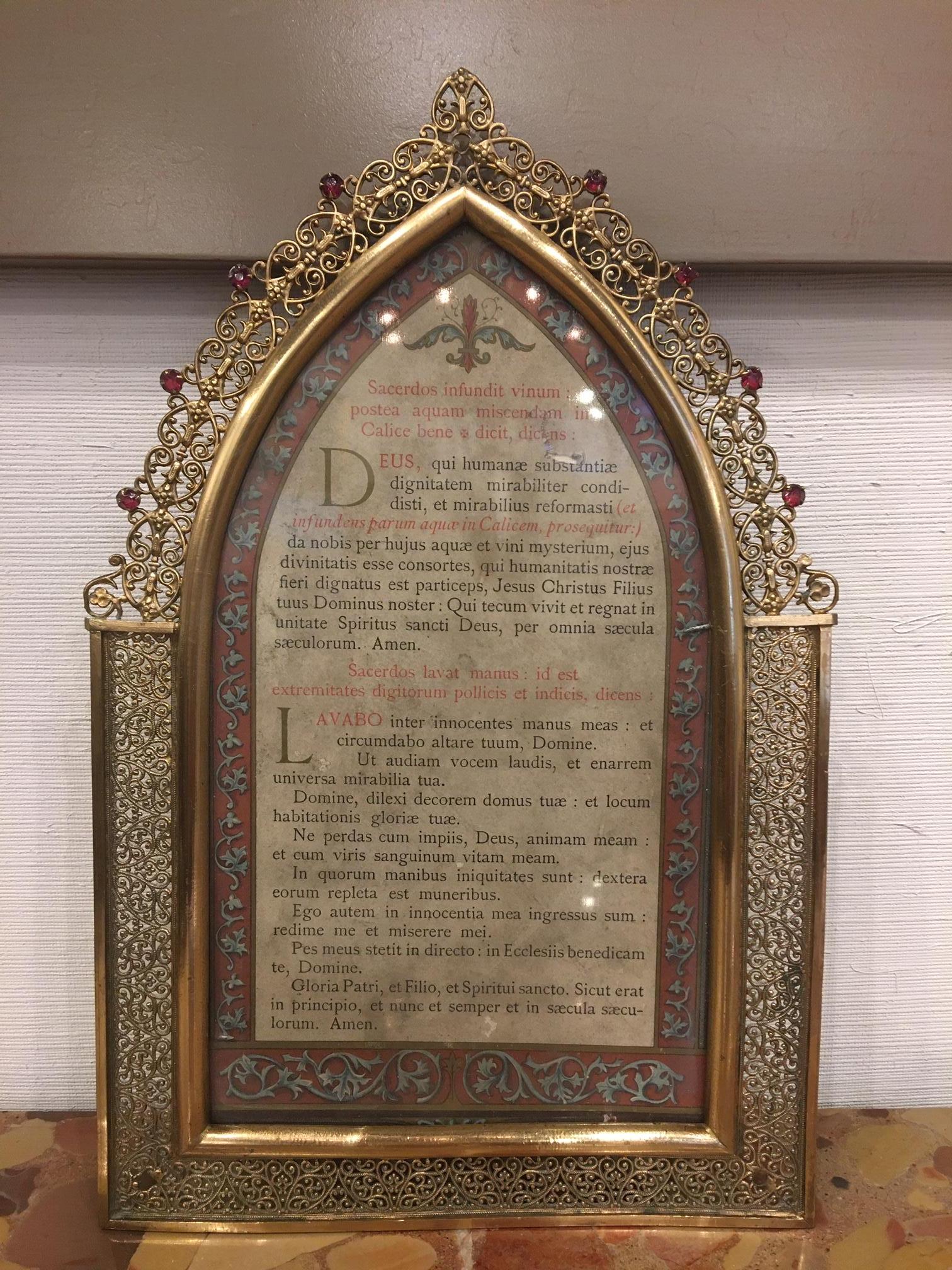 Polished brass picture frame with decorative trim around, 19th century. Wording is in Latin.
