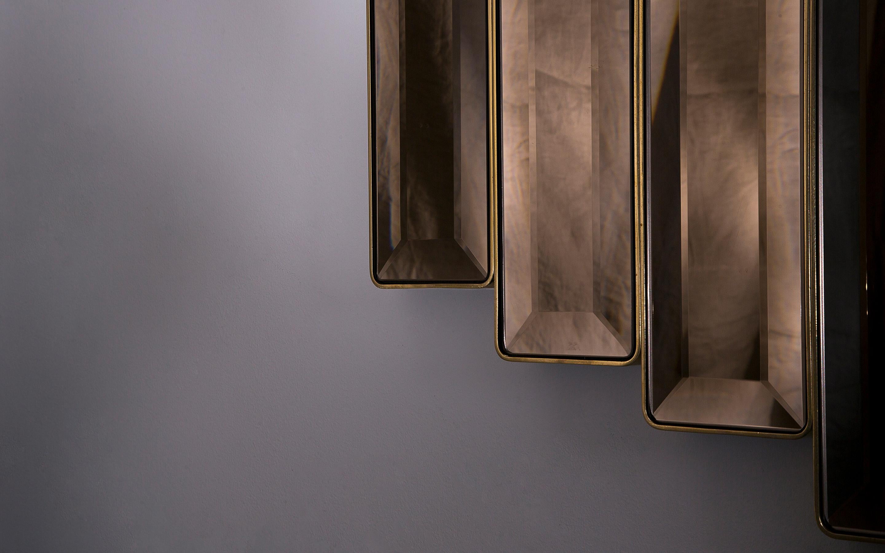 Tata Polished brass sculptural mirror signed by Novocastrian
Measures: 110 (W) x 100 (H) x 2 (D)
Materials: Polished Brass
Custom sizes available.

Wall-mounted Tata mirror with polished brass frame. Beveled bronze or grey tinted glass available.