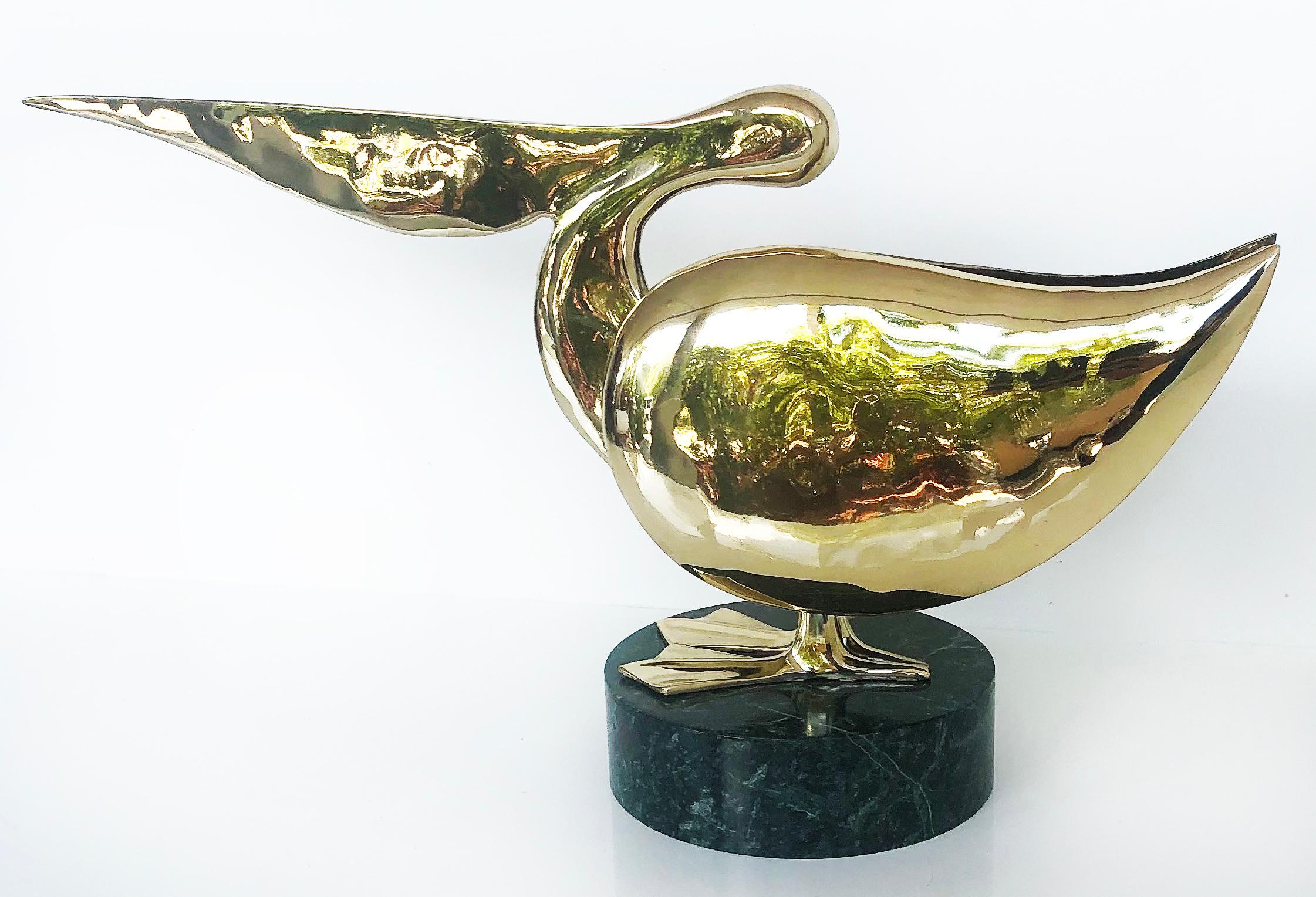 Polished brass stylized pelican sculpture on marble base

Offered is a substantially sized polished brass stylized pelican sculpture on a green, round marble base. The sculpture will look great on a desk or on bookshelves.

  