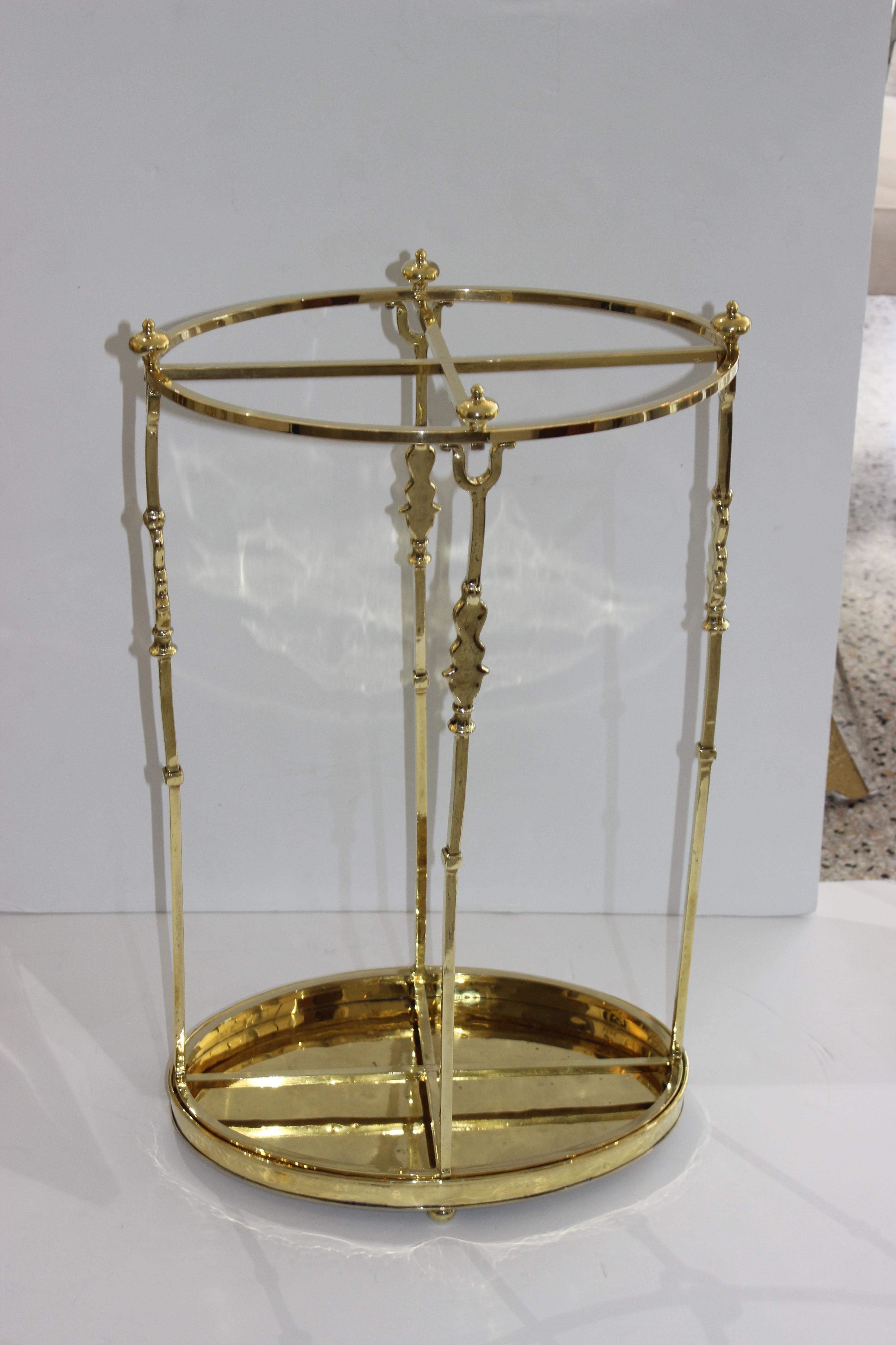 This large scale, stylish and chic polished brass umbrella stand was acquired from an estate in Paris and has been professionally polished and lacquered and thus no tarnishing. 

Note: The bottom tray is removable for cleaning purposes.

Note: 