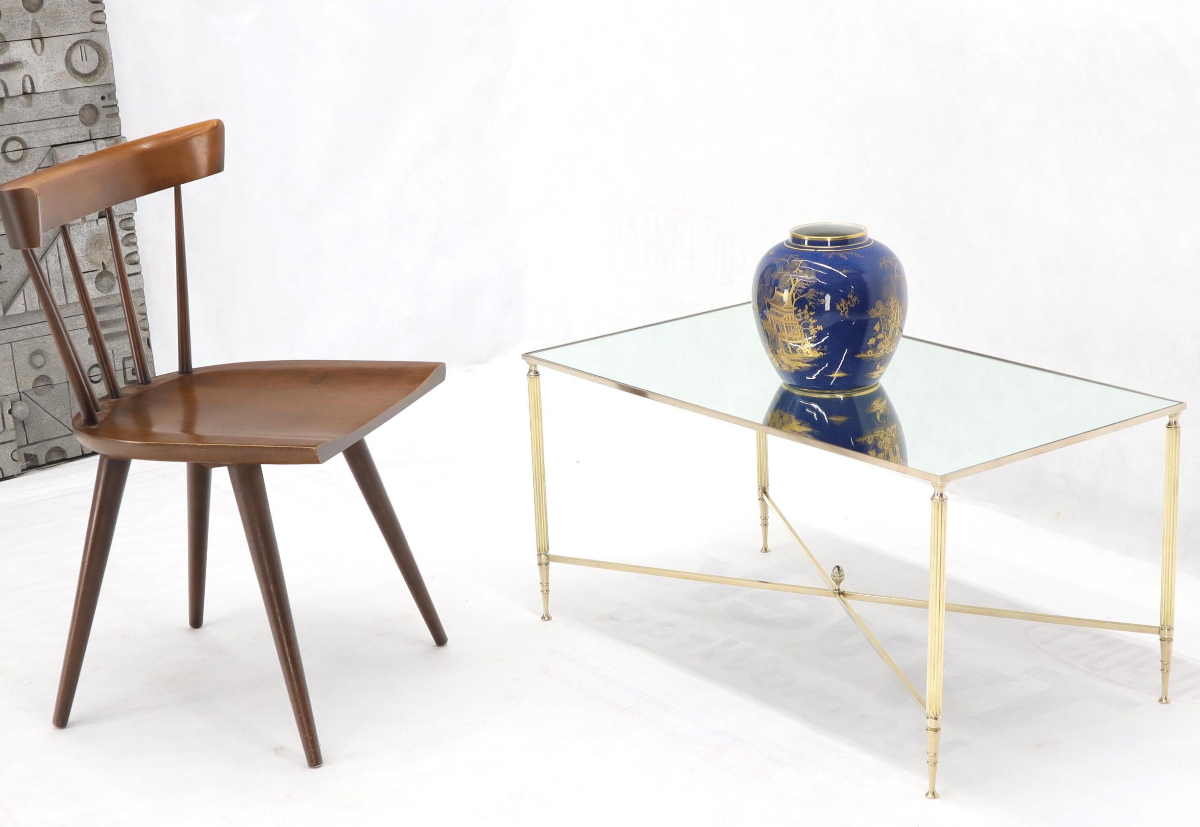 Midcentury Italian modern brass and mirrored glass top compact petit coffee table. Solid brass pineapple finial in the center of X-shape stretcher.