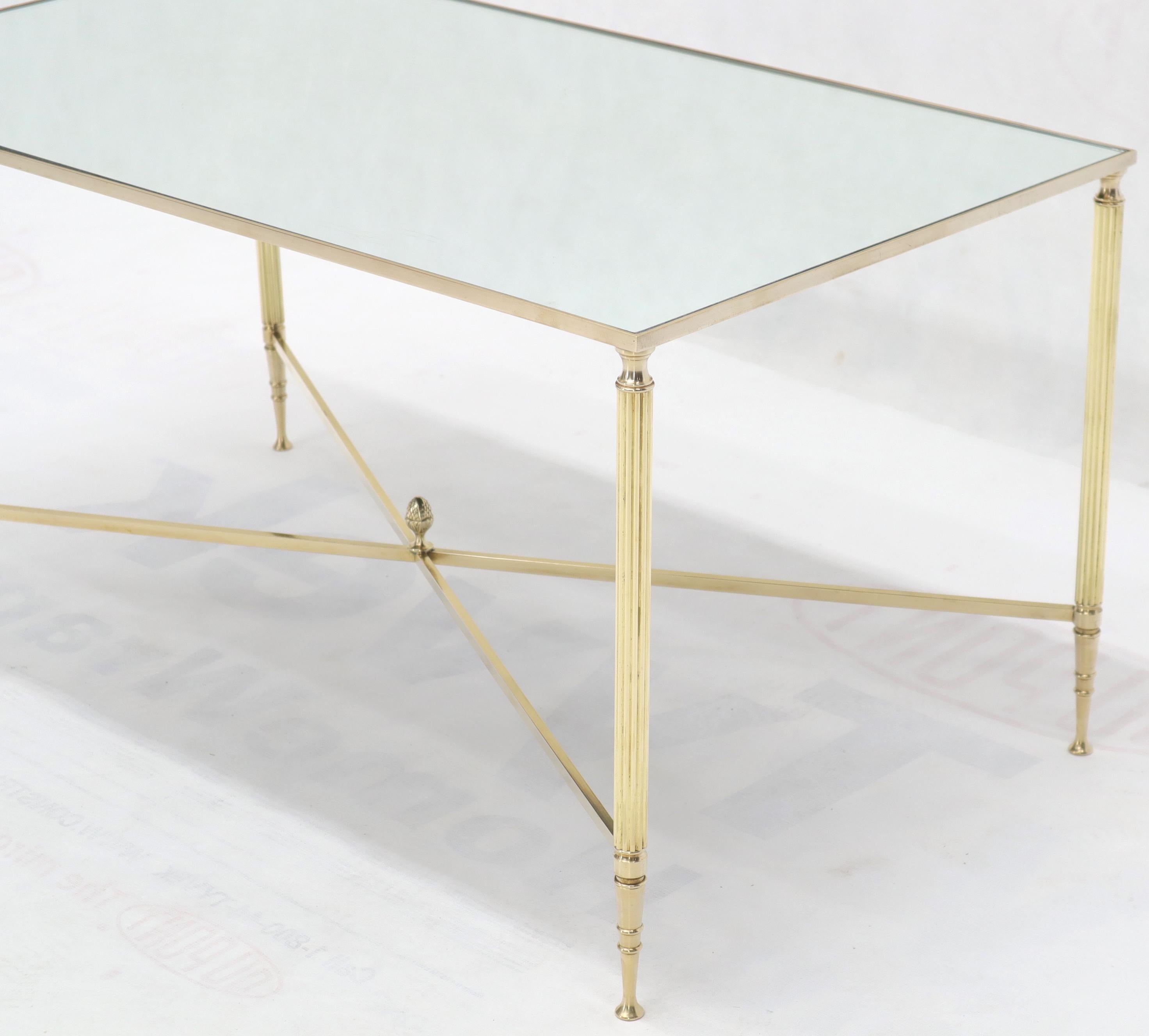 Polished Brass X-Stretcher Base Fluted Legs Mirrored Glass Top Coffee Table In Excellent Condition For Sale In Rockaway, NJ