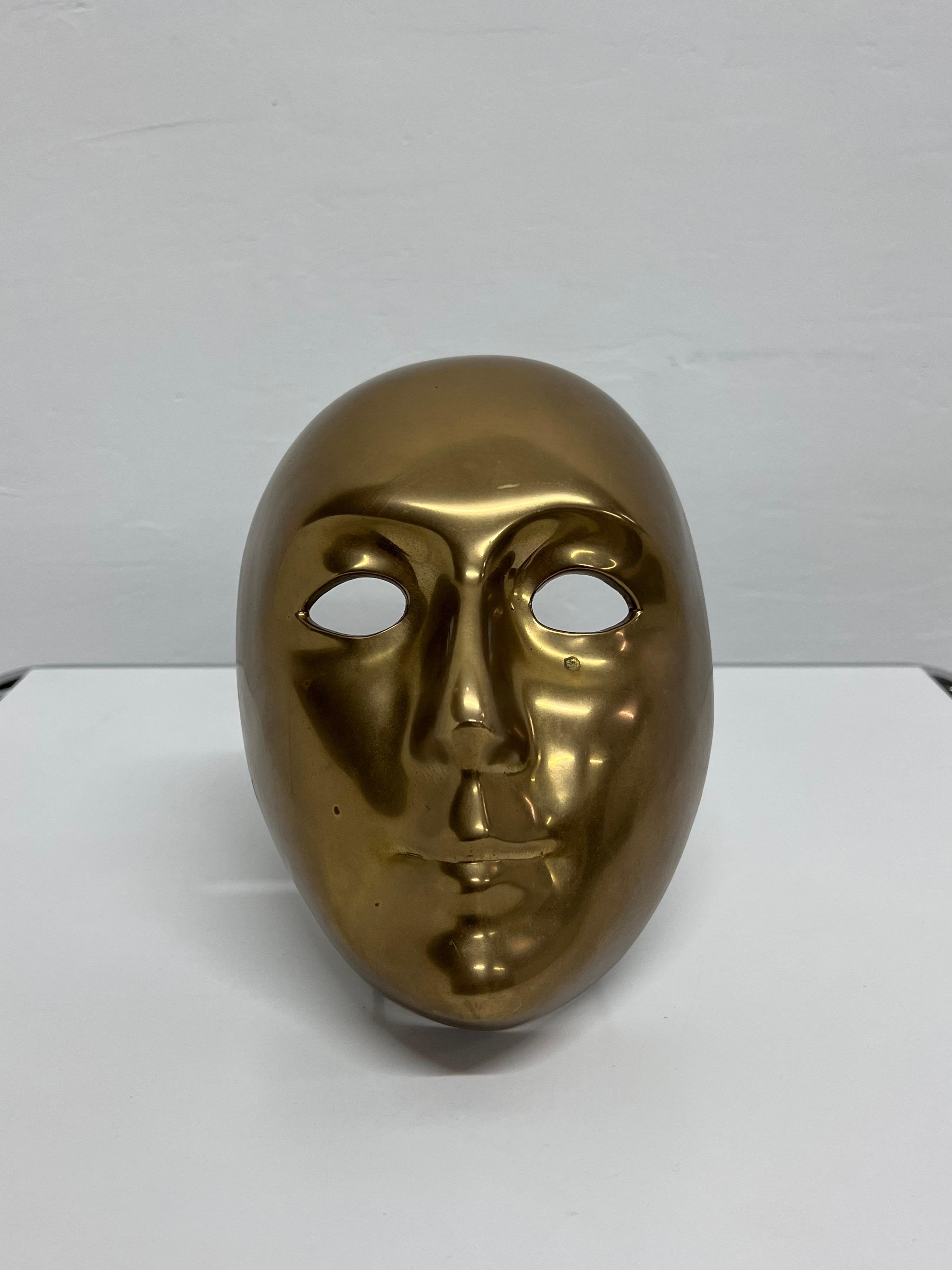Polished bronze Venetian face by CM Volare, 1994.