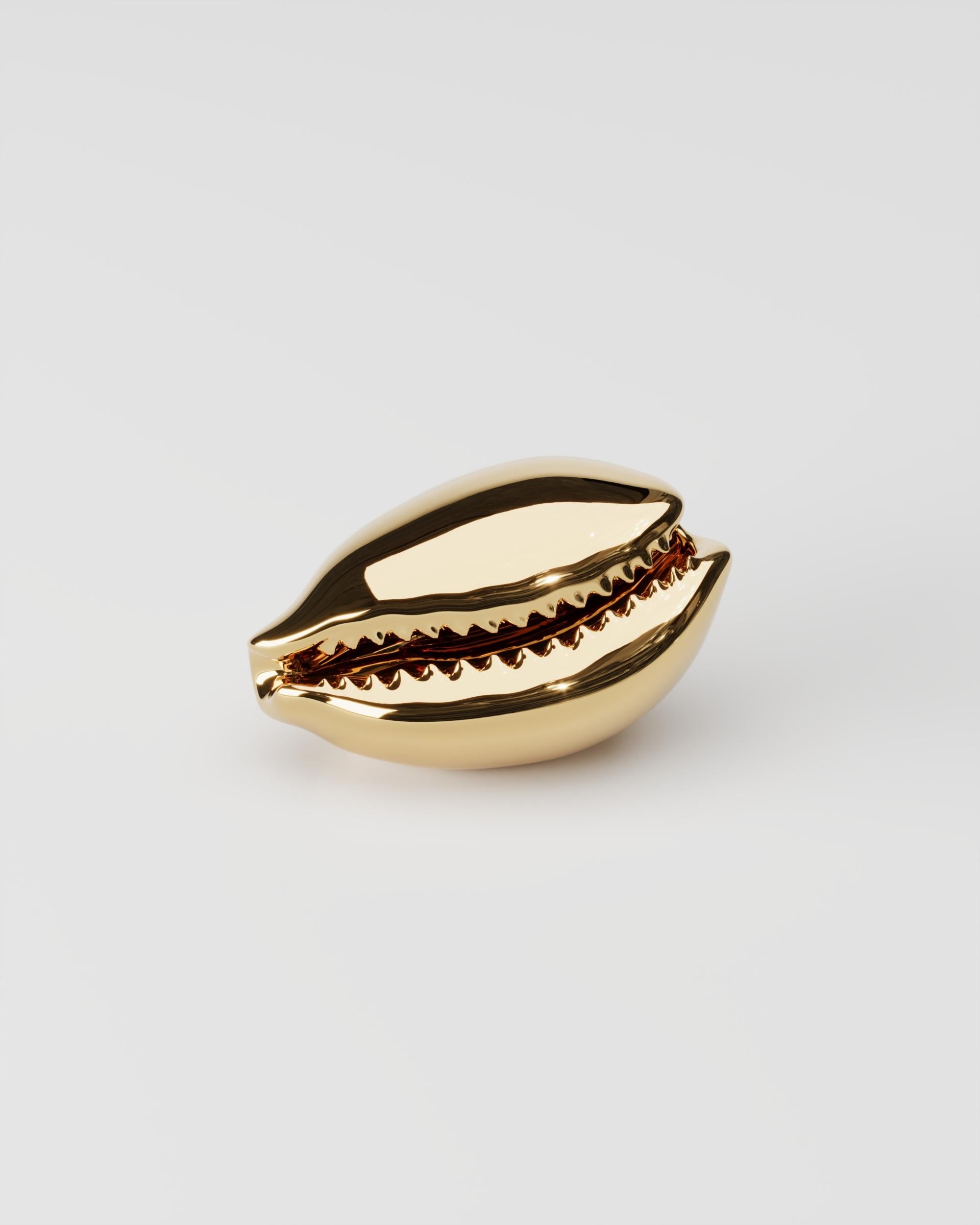 Polished Cast Brass Buzio P Sculptural Object by Studio Orth
Dimensions: W 12 x D 7 x H 7 cm
Materials: Cast metal.
Finishes: Polished Cast Brass or Polished Cast Aluminum

About: 
Studio Orth is a multidisciplinary furniture and interior design