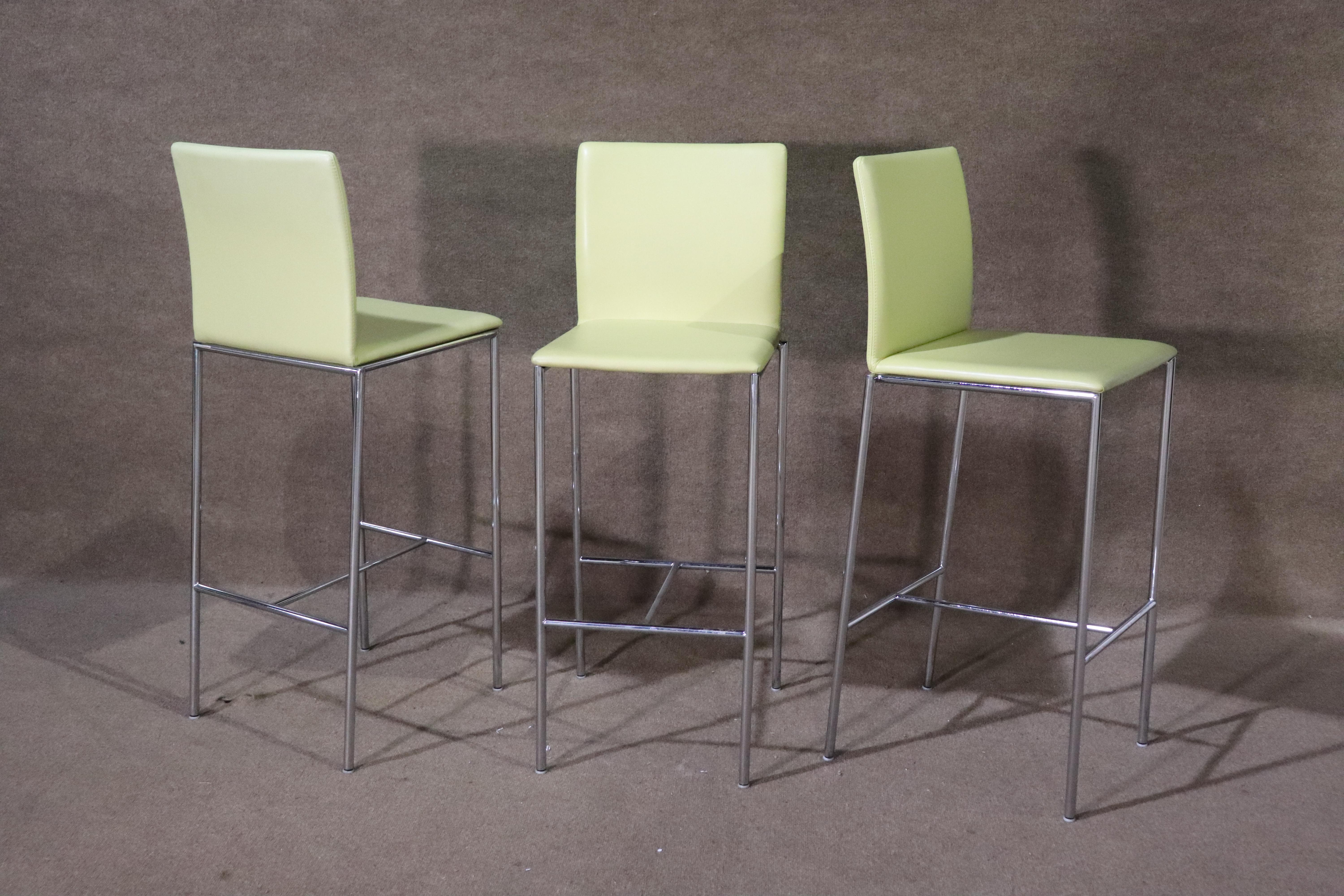 Set of three bar stools with slender polished chrome frames and soft cushions.
Please confirm location NY or NJ