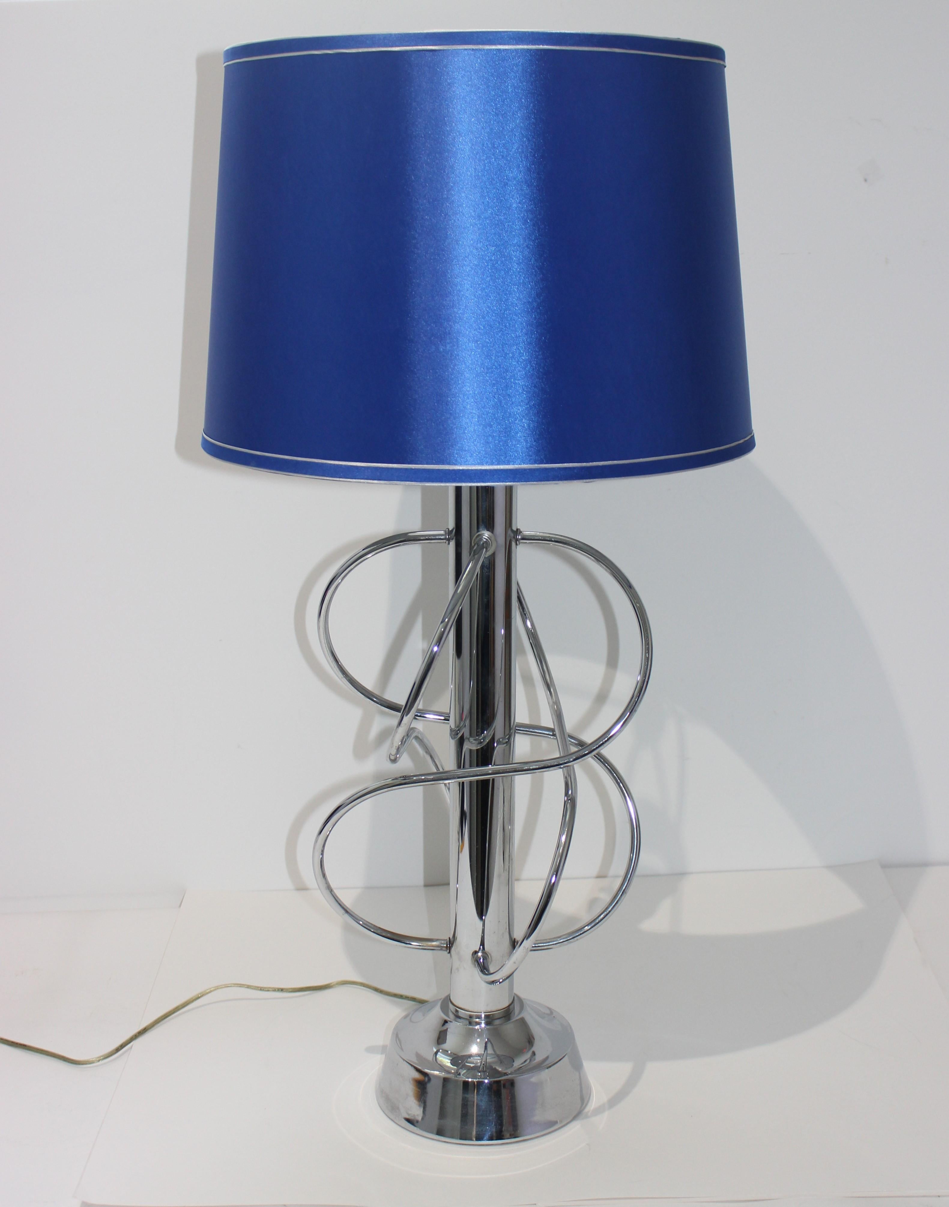 This stylish Scolari inspired polished chrome table lamp dates to the 1970s.

Note: Height to top of socket 25