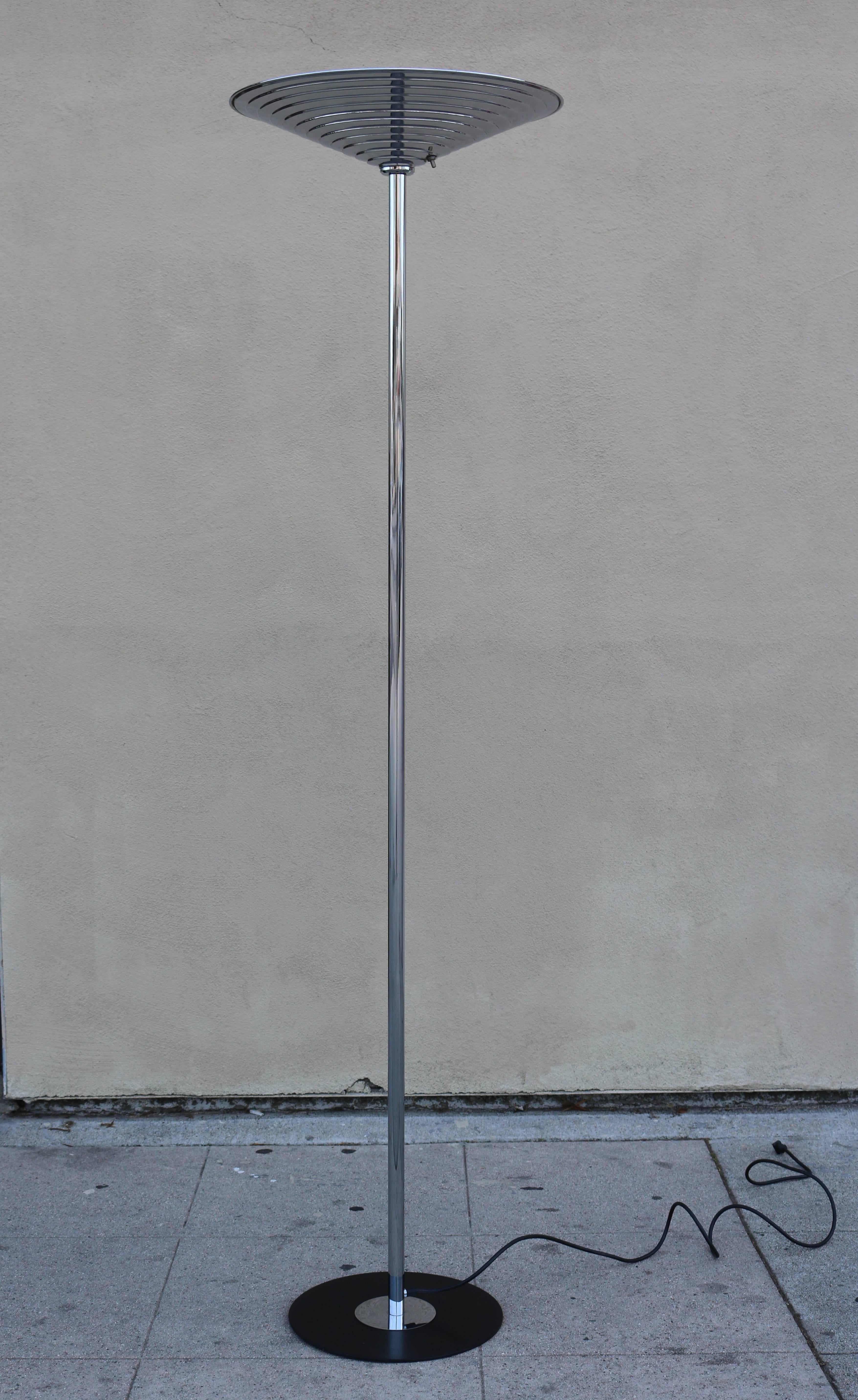 Torchiere has a polished chrome stem and stepped shade. Shade measures 19
