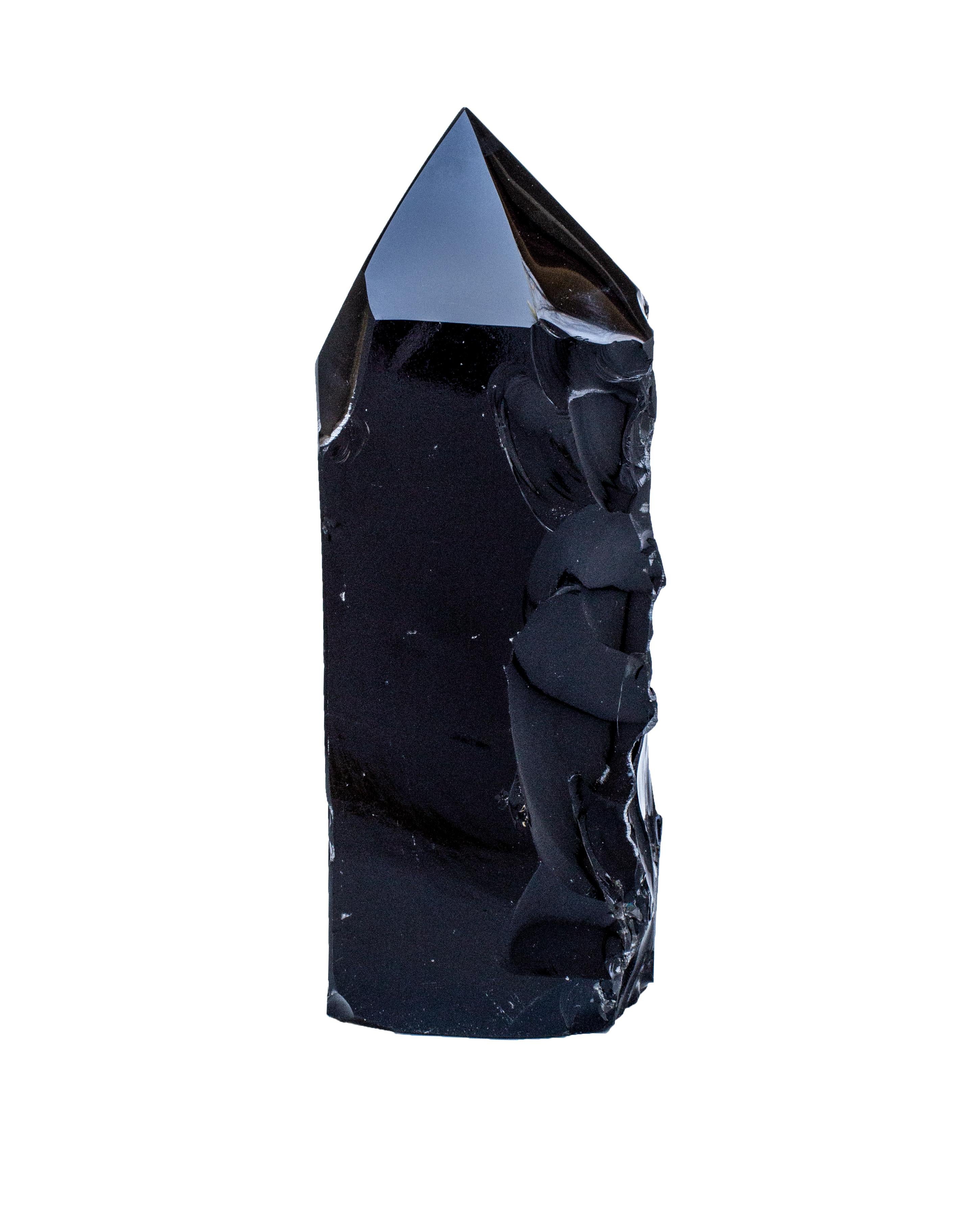 Polished black obsidian point with natural forming indentions. The point was cut and polished to completion, but parts of this piece are left in its organic form to resemble a natural forming sculpture combined with the hand of man. 

Obsidian is a