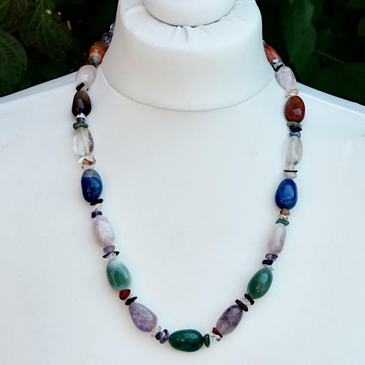 Fabulous gemstone necklace with a silver tone barrel clasp. The beautiful polished gemstones include rose quartz, amethyst and agate. The large beads are interspersed with sets of three smaller beads. Measuring length 62 cm / 24.4 inches.

This is a