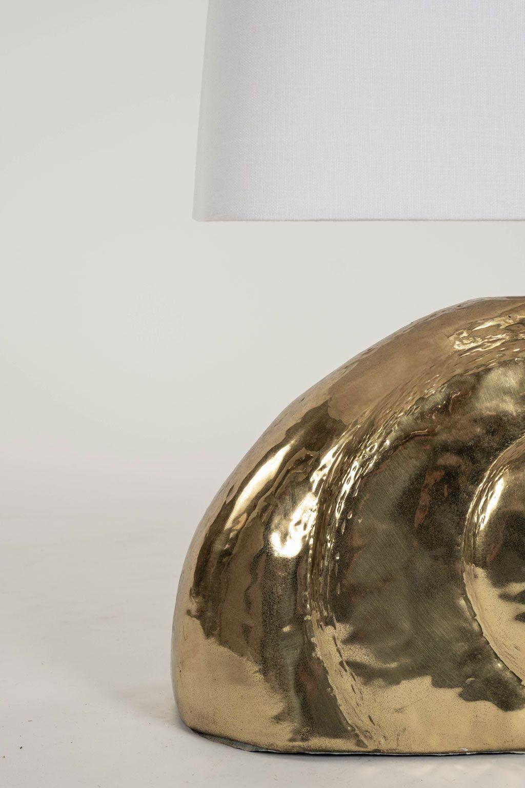 Polished gilt-brass nautilus lamp, circa 1960-1979, France. Newly wired for use within the USA with medium-base (Edison) socket. Includes rectangular linen shade (measurements include shade) and line switch.