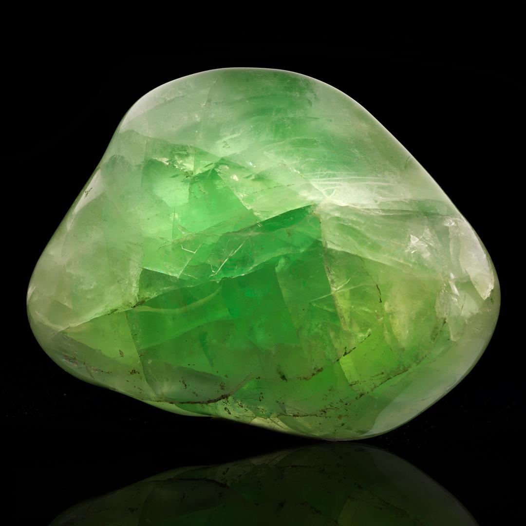 This nearly five and a half pound excellent quality green fluorite specimen from China has been expertly hand-polished to bring out a beautiful luster. Vividly pigmented, this piece has good clarity with natural rainbows and a lovely freeform shape.