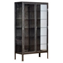 Polished iron medical cabinet, 1930s