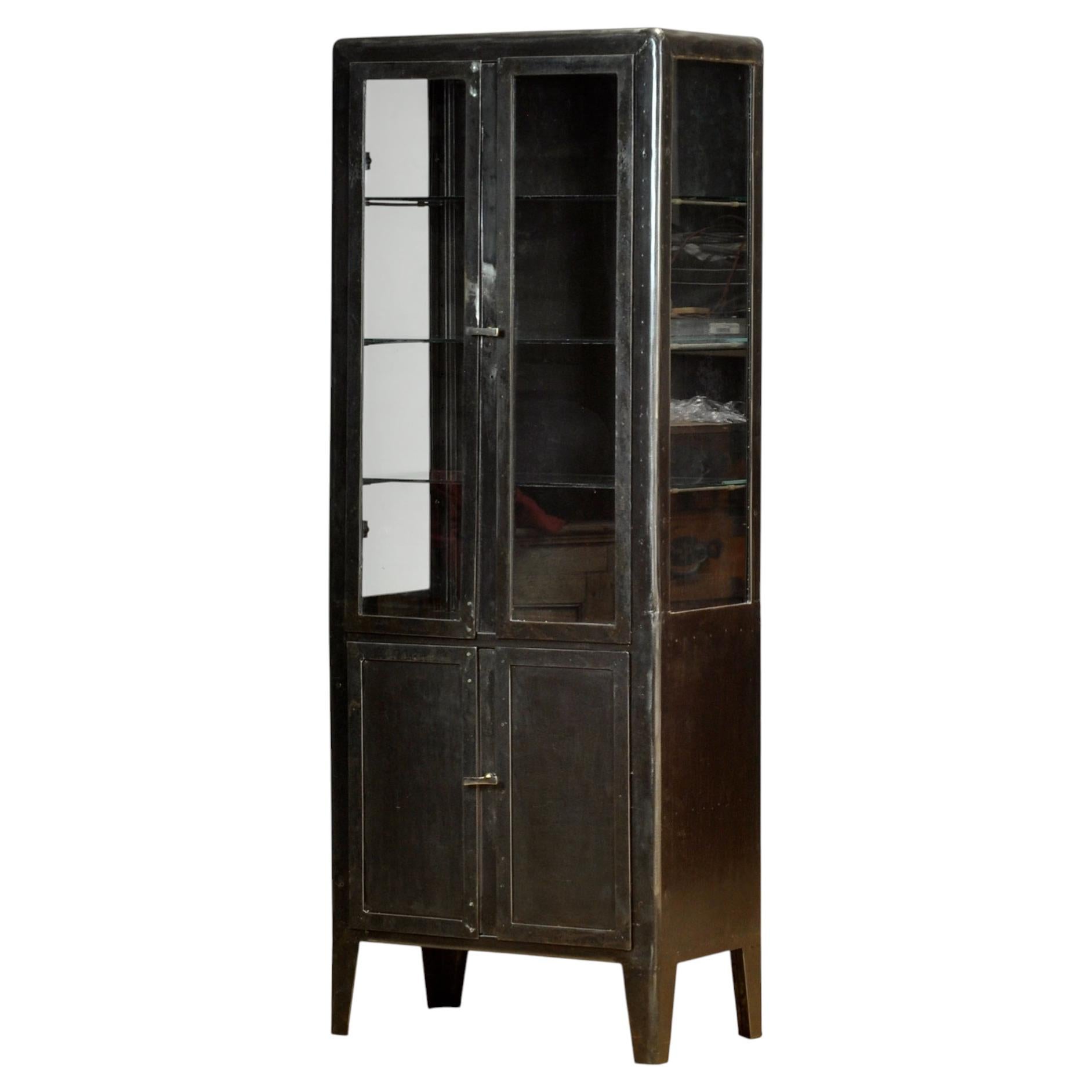 Polished iron medical cabinet, 1930s